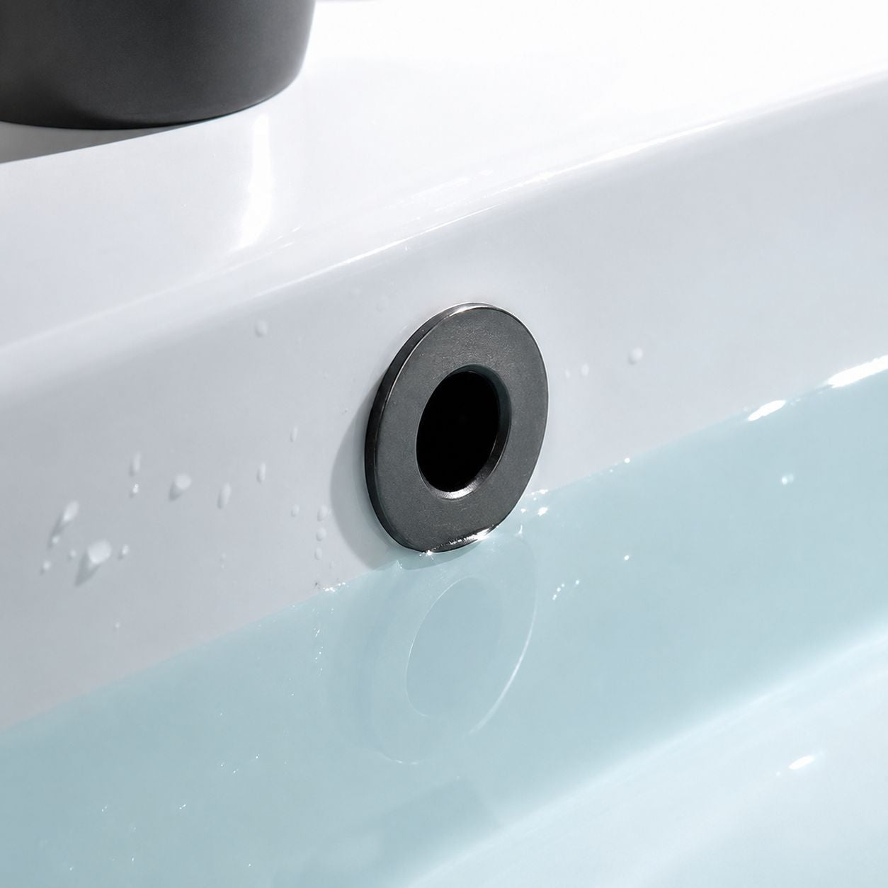 Chrome basin overflow cap fitted to white bathroom basin — Bathroom Republic UK