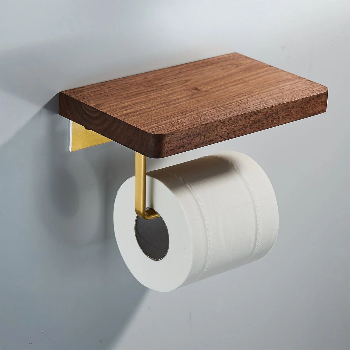 Brass and wood toilet brush holder with wall shelf in a white bathroom — Bathroom Republic UK