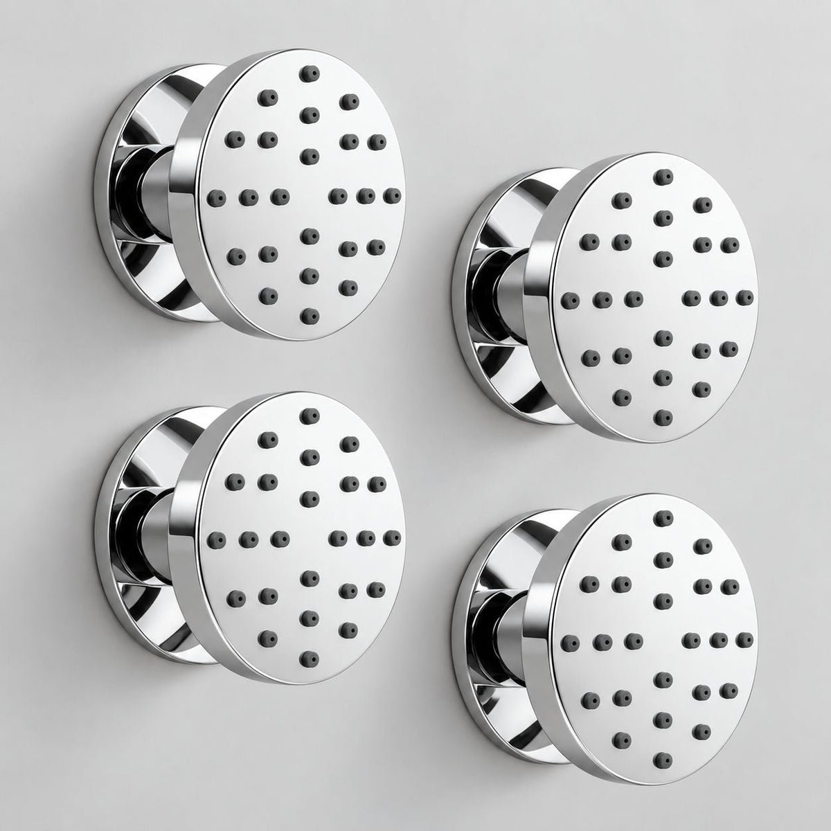 Four round chrome body shower jets with black spray nozzles, shown in a 2x2 arrangement on a light gray background.