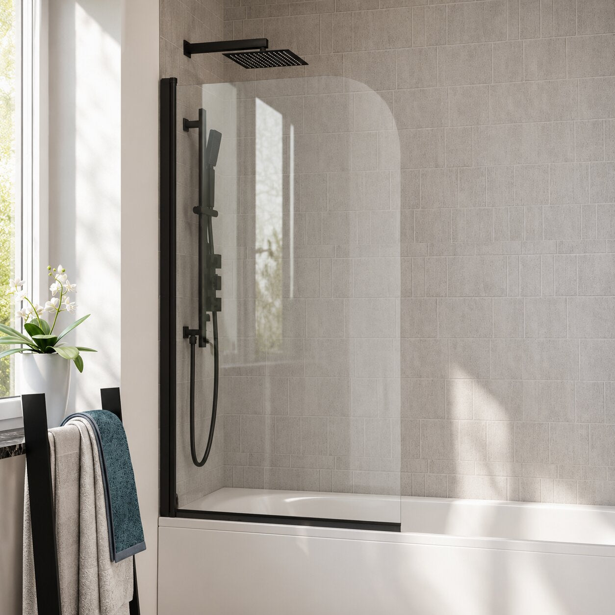 Matt black curved bath screen with bowed glass panel on an alcove bath — Bathroom Republic UK