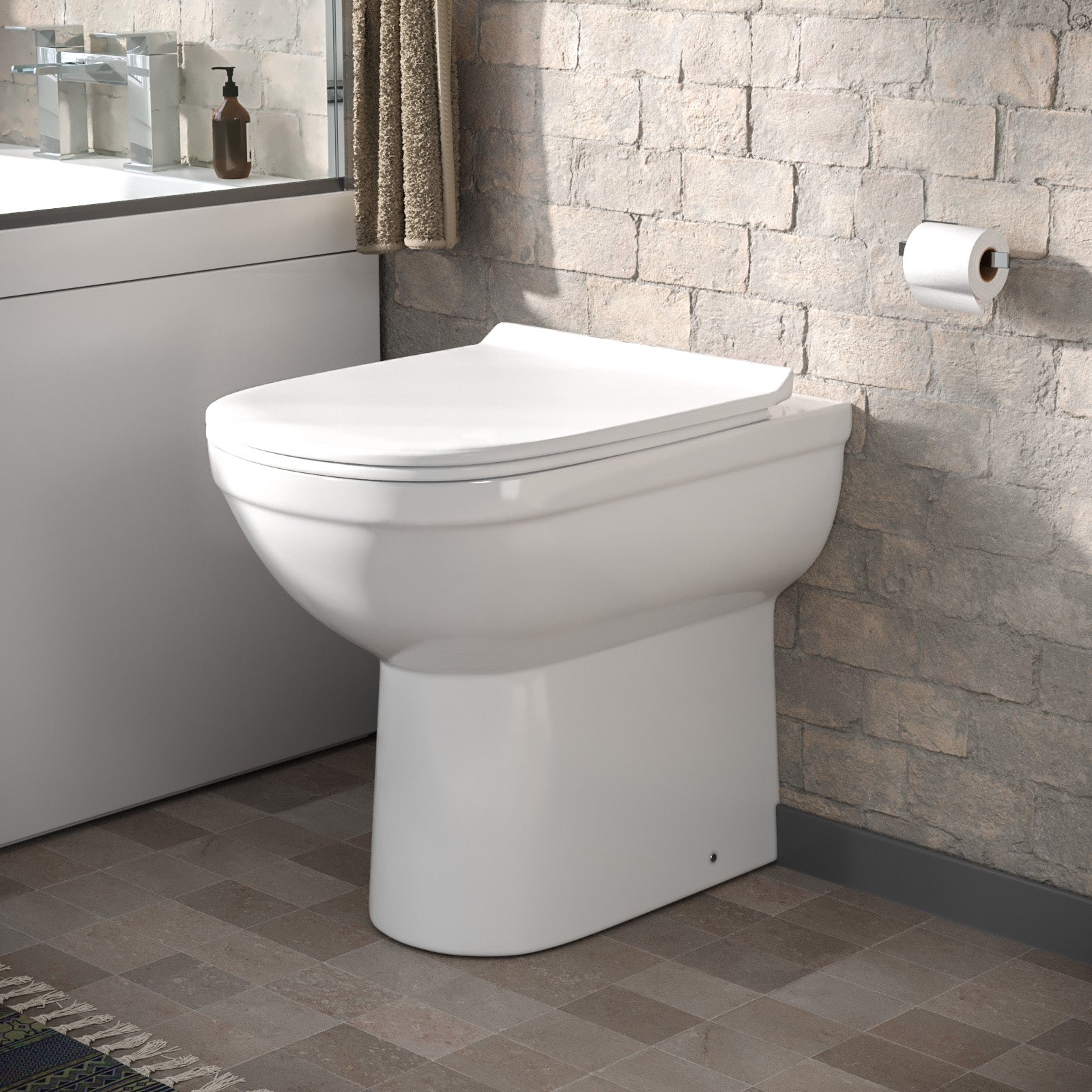 White back to wall toilet pan with concealed cistern and wall-mounted flush button — Bathroom Republic UK