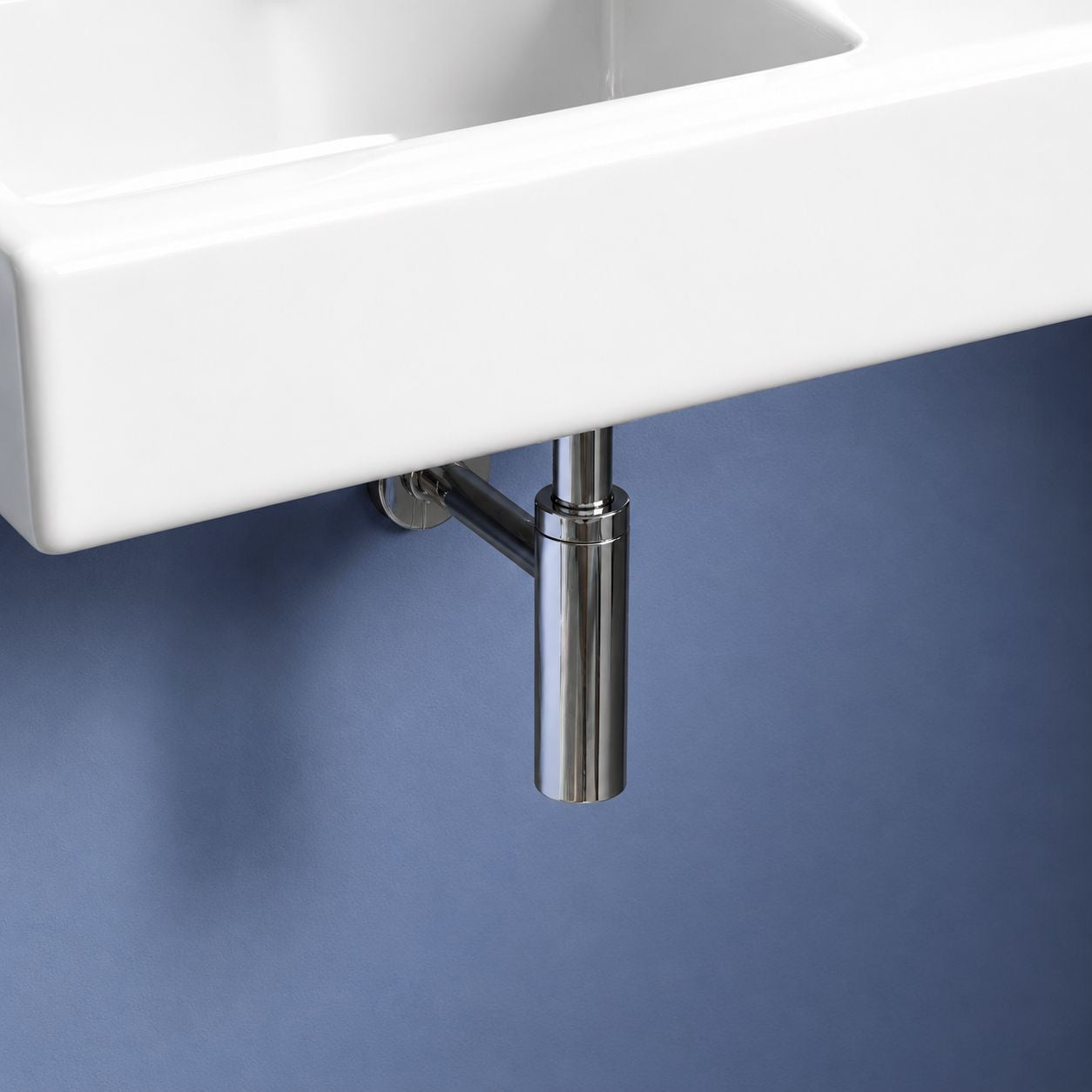 Brushed gold towel ring and bathroom basin accessories on white tiled wall — Bathroom Republic UK
