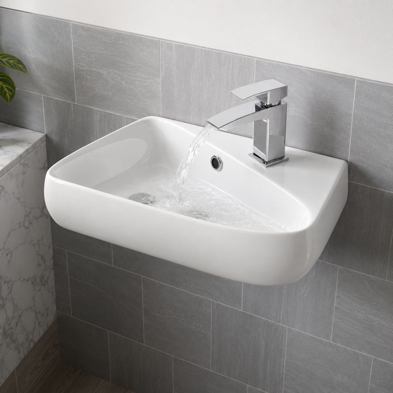 White rectangular wall-mounted basin on a grey tiled bathroom wall — Bathroom Republic UK