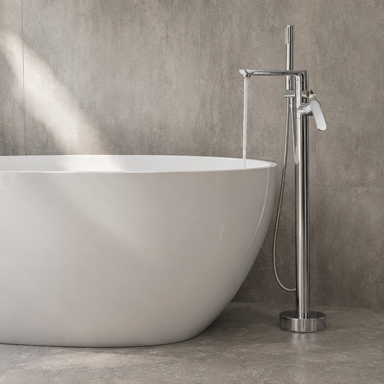 Chrome floor-mounted freestanding bath tap on a white freestanding bath — Bathroom Republic UK