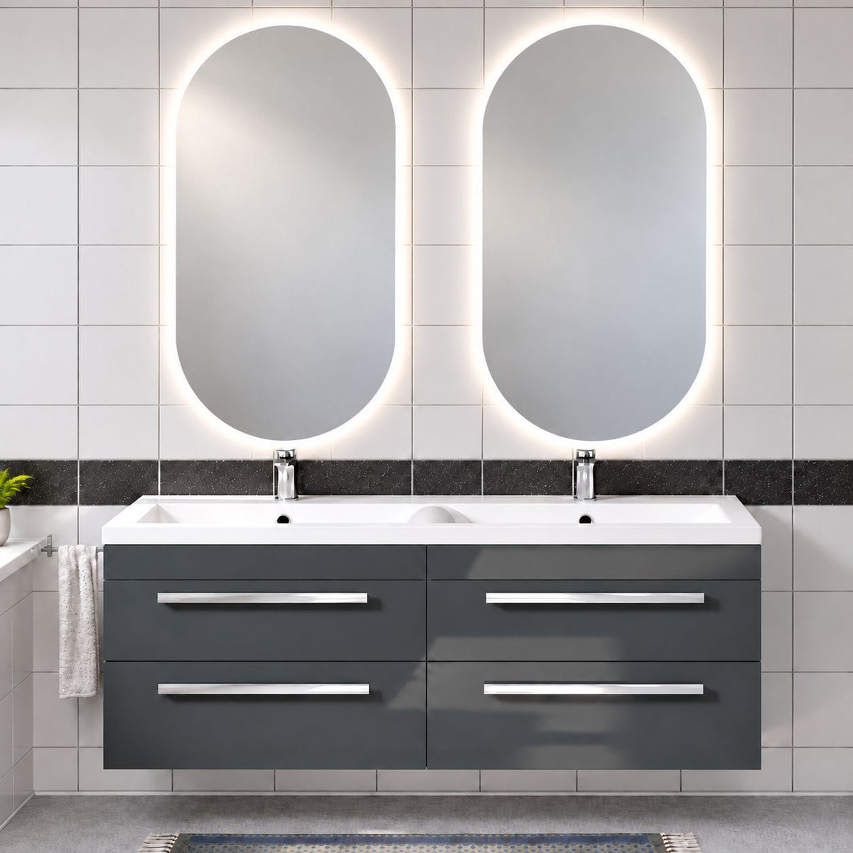 Dark grey wall-hung double basin vanity unit with four drawers, chrome mixer taps and two illuminated pill-shaped LED bathroom mirrors.