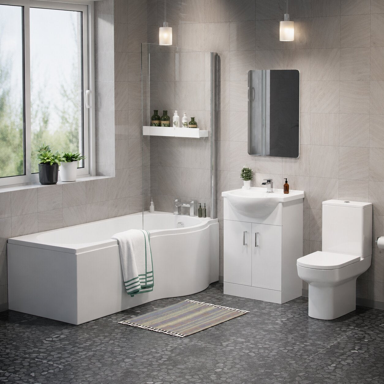 P-shaped bath suite with wider curved showering end, matching toilet and vanity unit in white — Bathroom Republic UK