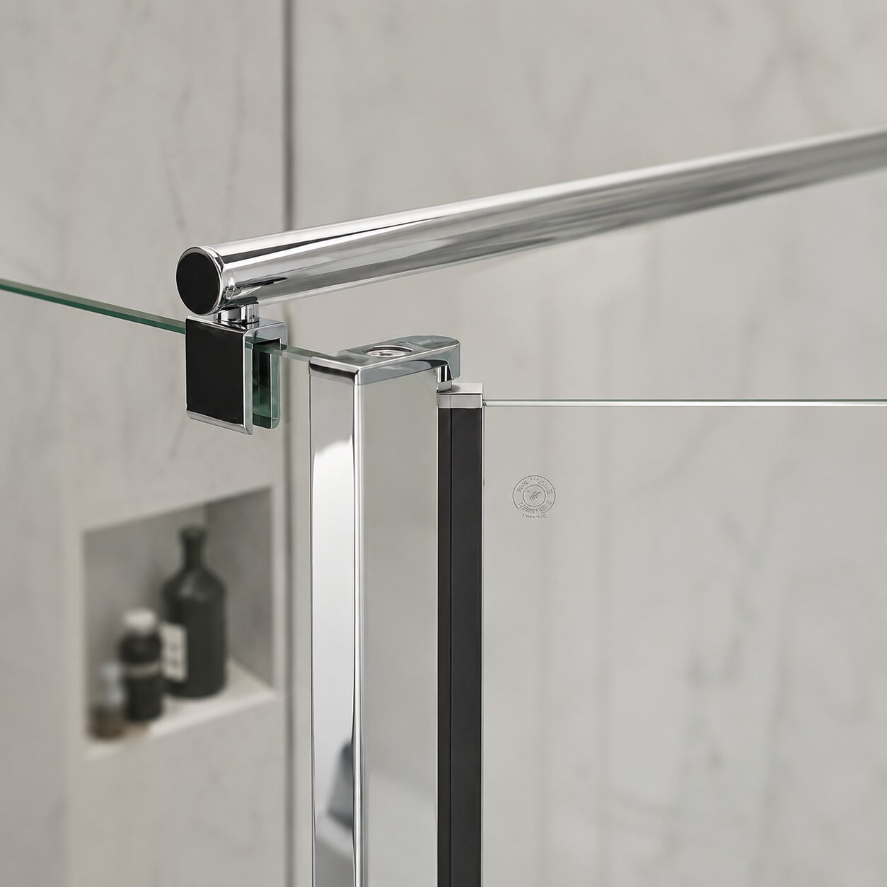 Chrome shower enclosure support arm mounted on wall bracket securing a frameless glass panel — Bathroom Republic UK