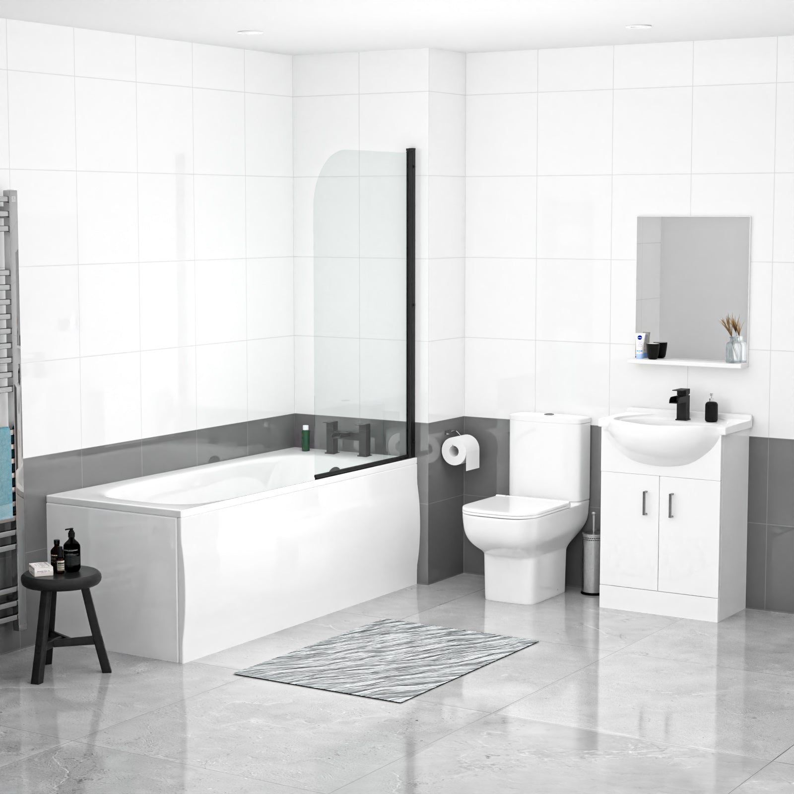 Modern bathroom with white bathtub, toilet, and sink against a gray wall.