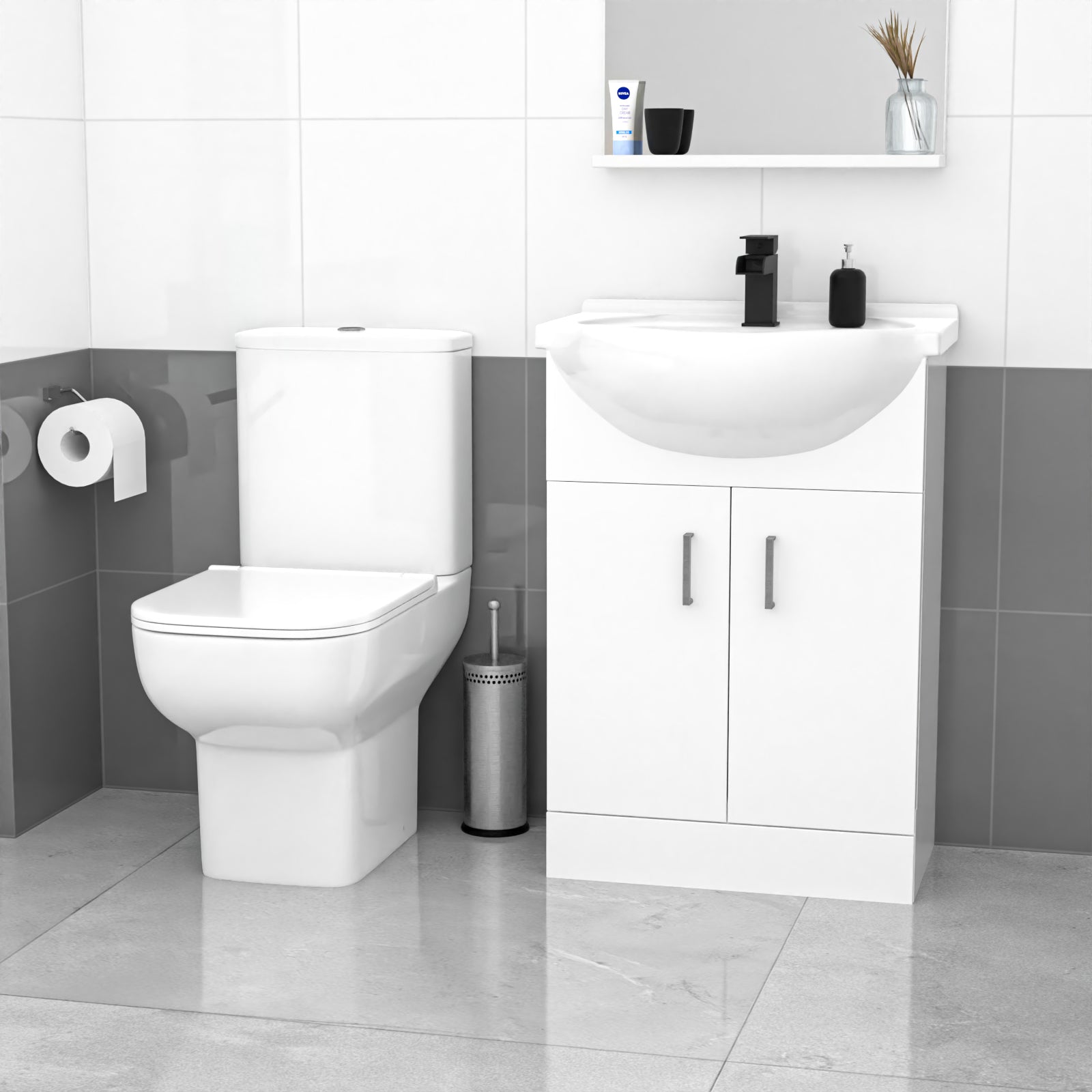 Bathroom setup with a toilet, sink, and cabinet against a tiled wall.