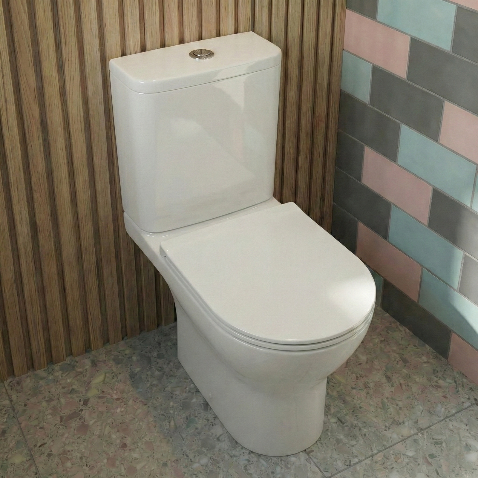White toilet in a bathroom with tiled walls