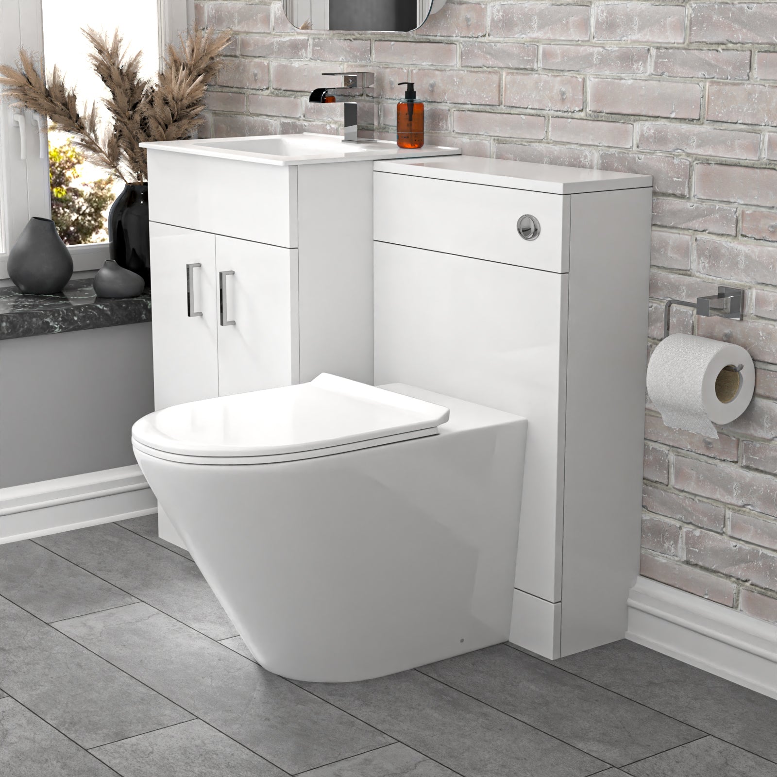 Bathroom setup with a toilet and vanity unit against a stone wall.