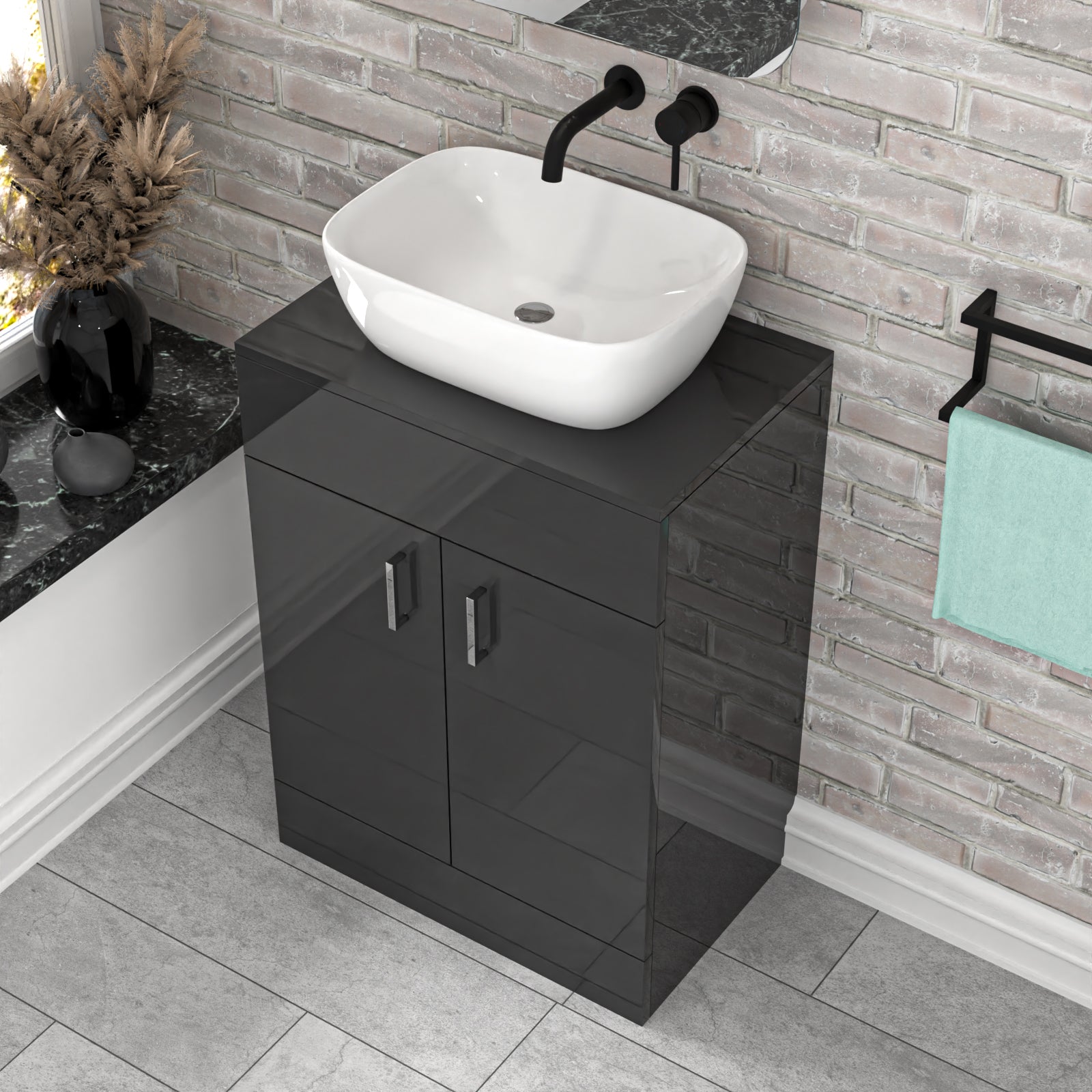 Bathroom setup with black vanity unit, white sink, and decorative elements.