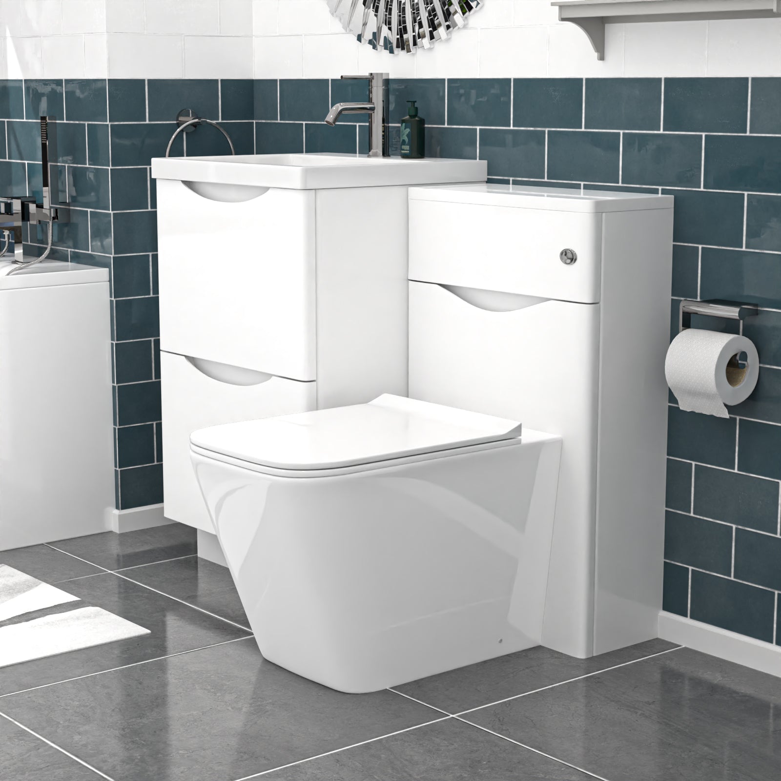 Bathroom setup with a white toilet and vanity unit against a blue tiled wall.