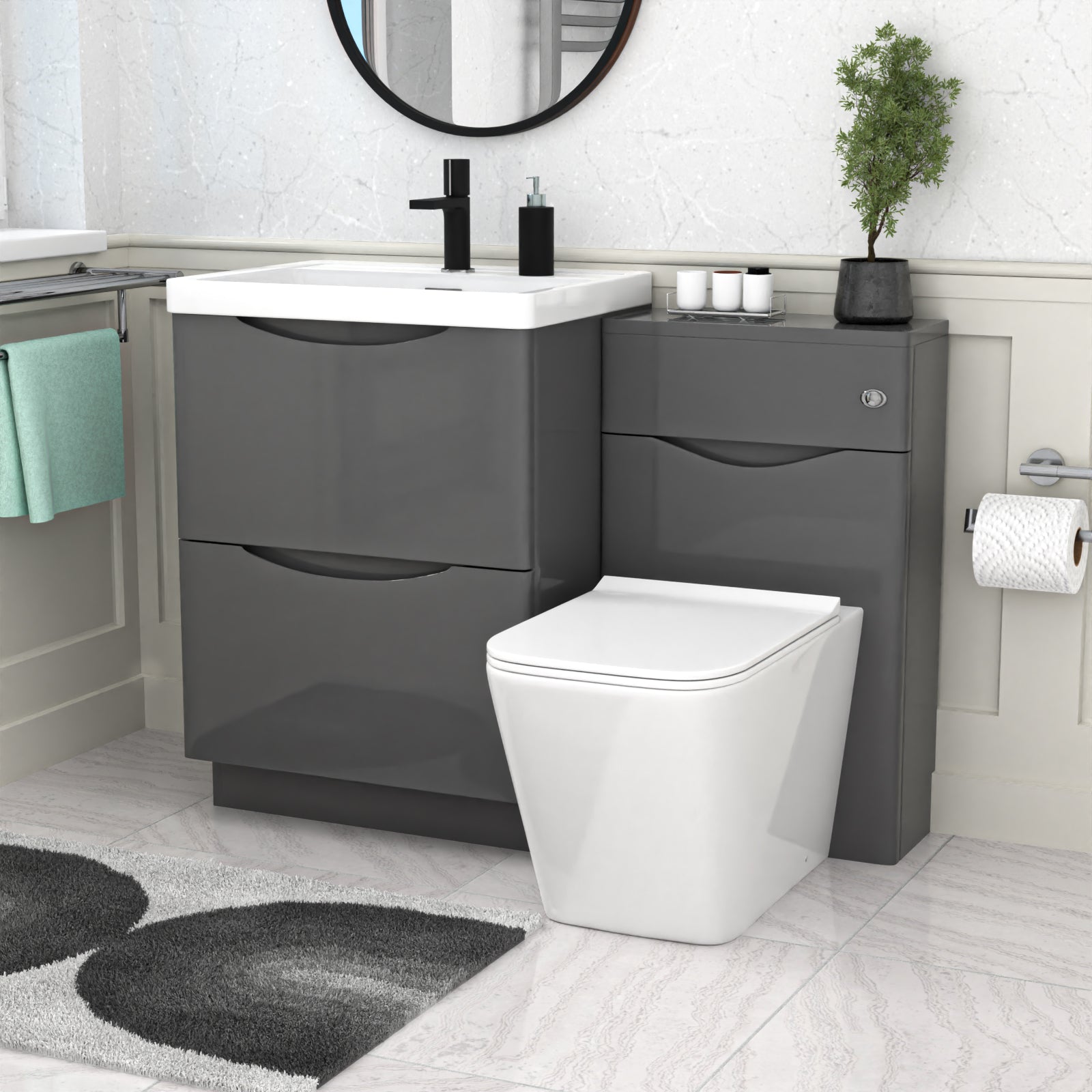 Bathroom setup with gray vanity unit, white toilet, and sink.