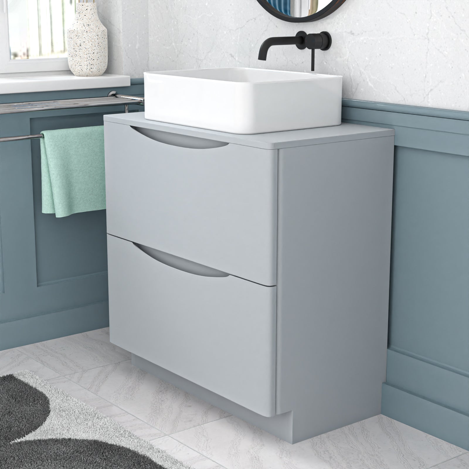 Gray vanity unit with white sink in a bathroom setting