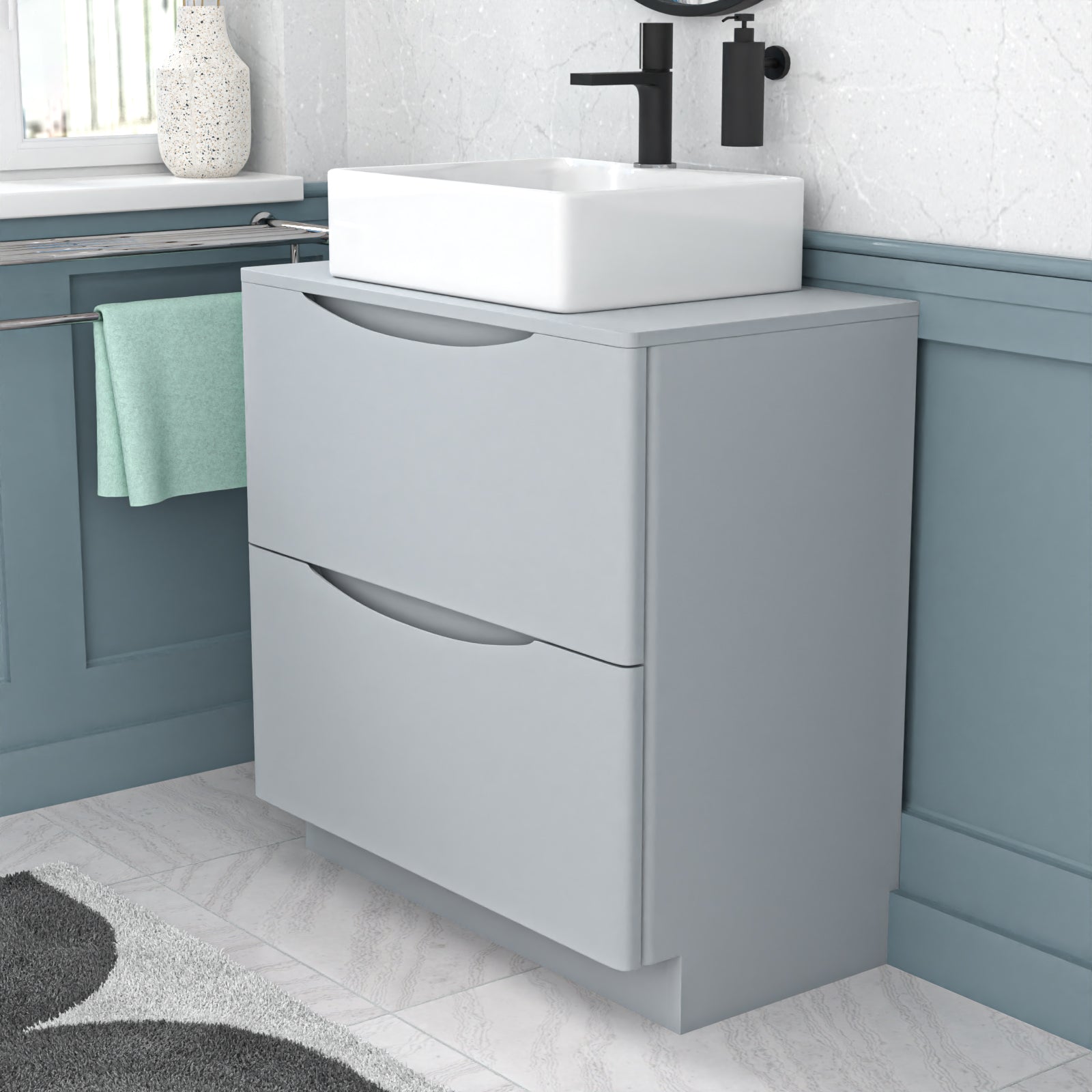 Gray vanity unit with white basin in a bathroom setting