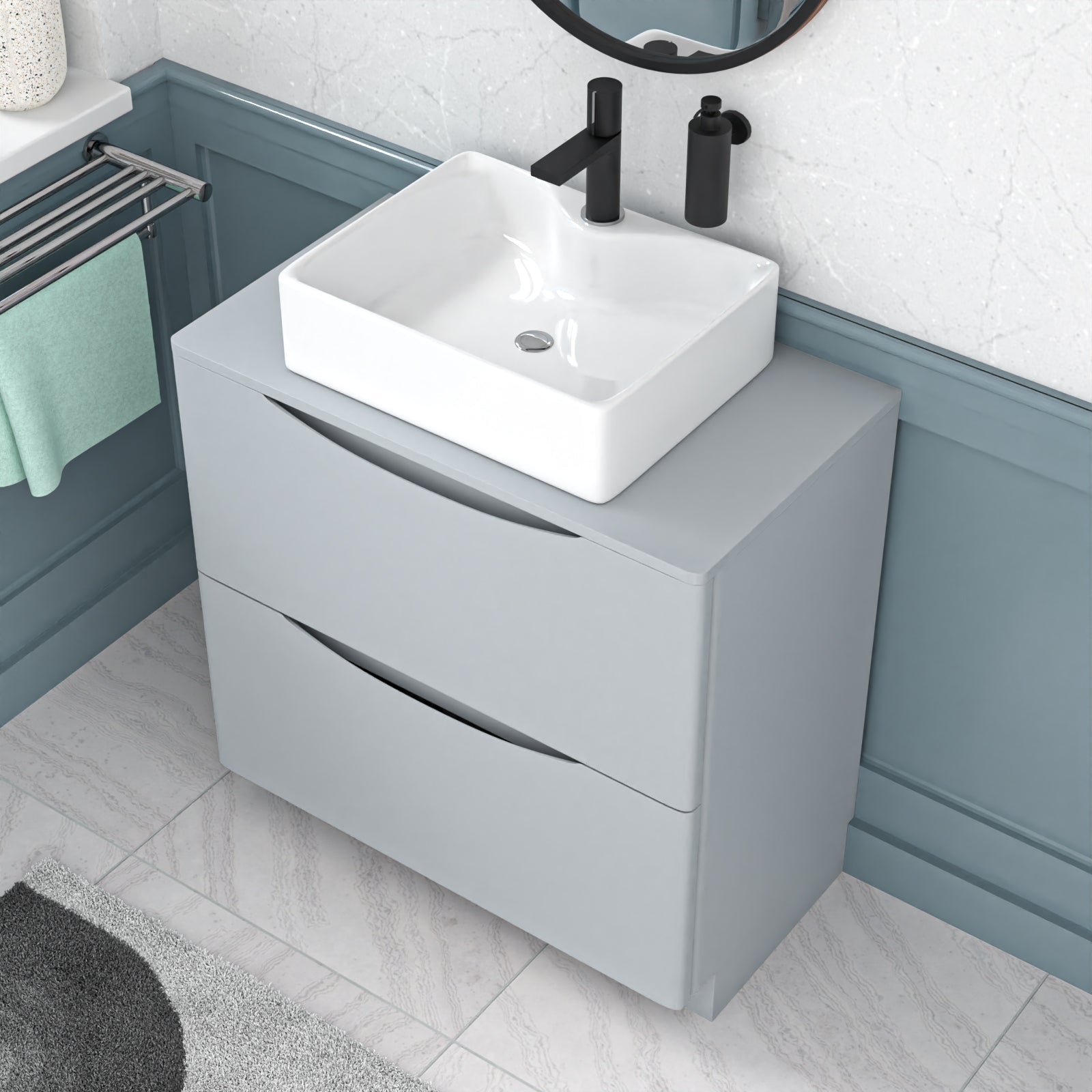 Bathroom vanity with white sink and gray cabinet against a blue wall.
