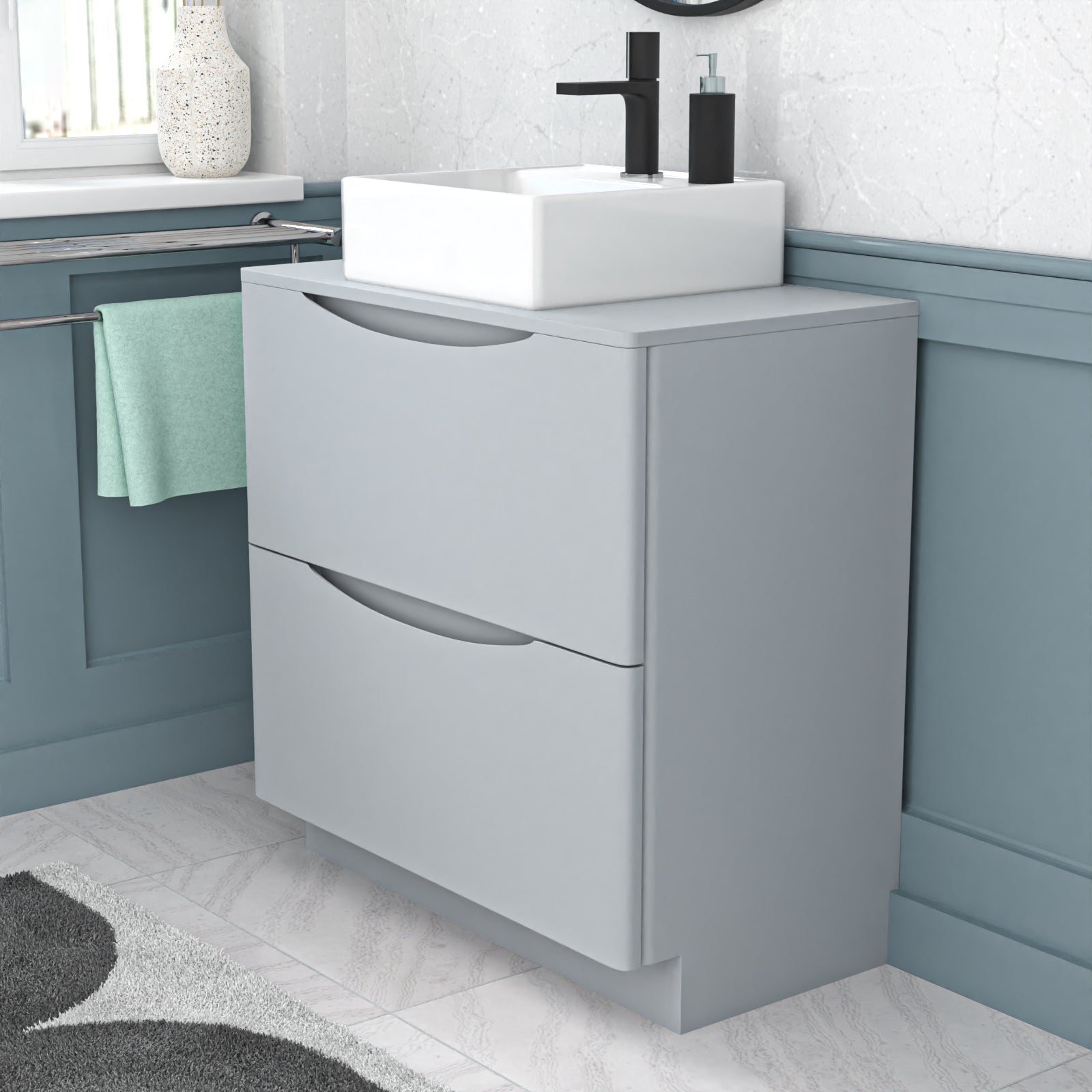Gray vanity unit with white sink in a bathroom setting