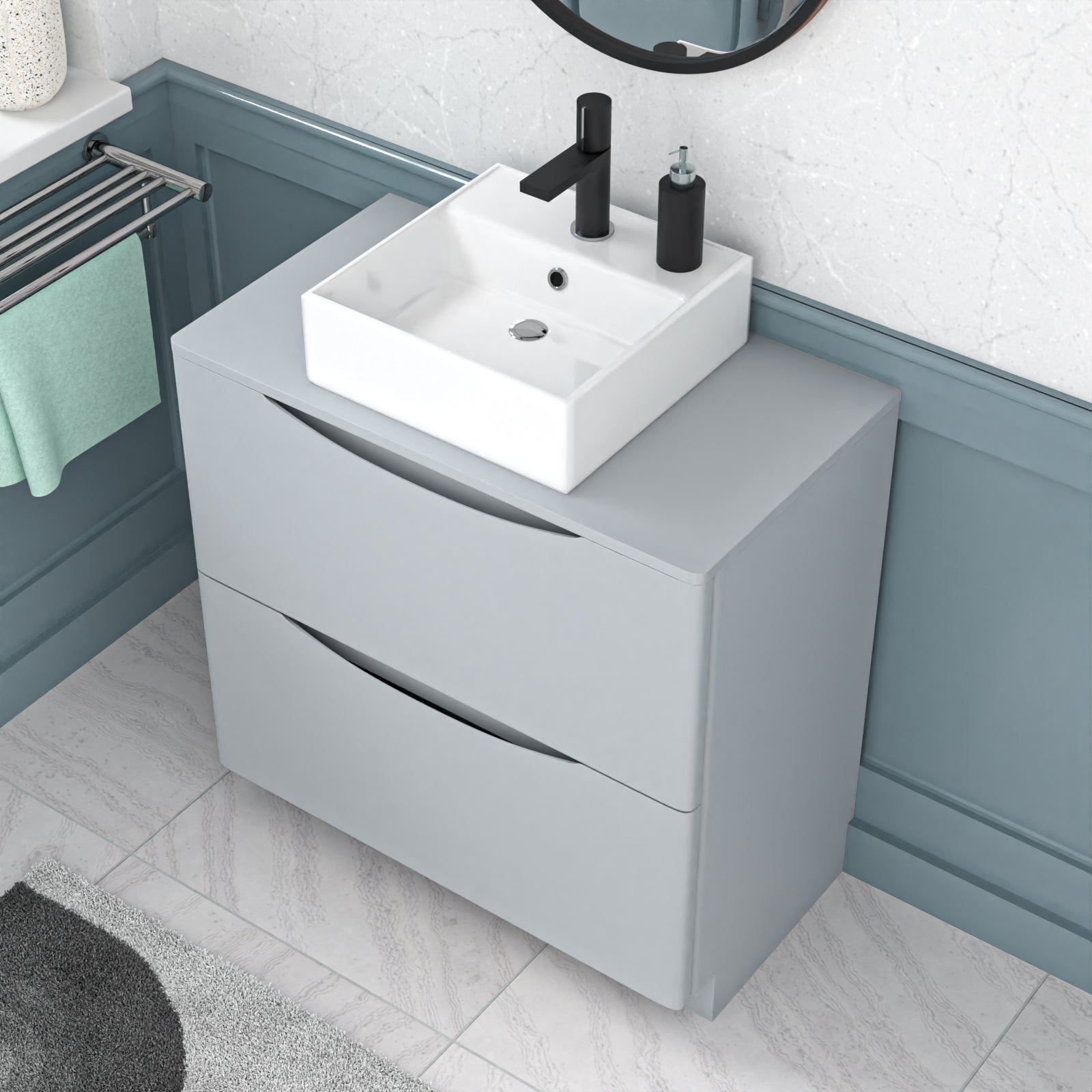 Bathroom vanity with white sink and black faucet against a blue wall.