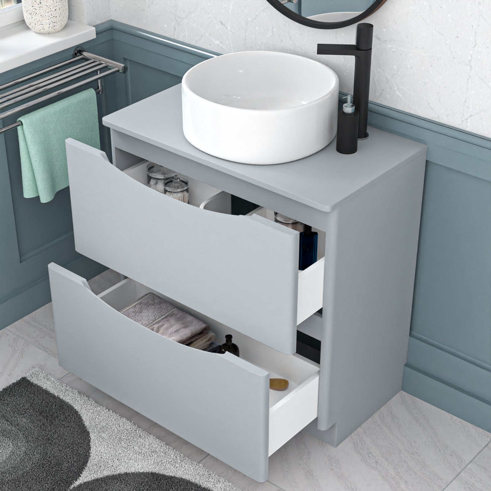 Bathroom vanity cabinet with a white sink and open drawers, featuring a black faucet.