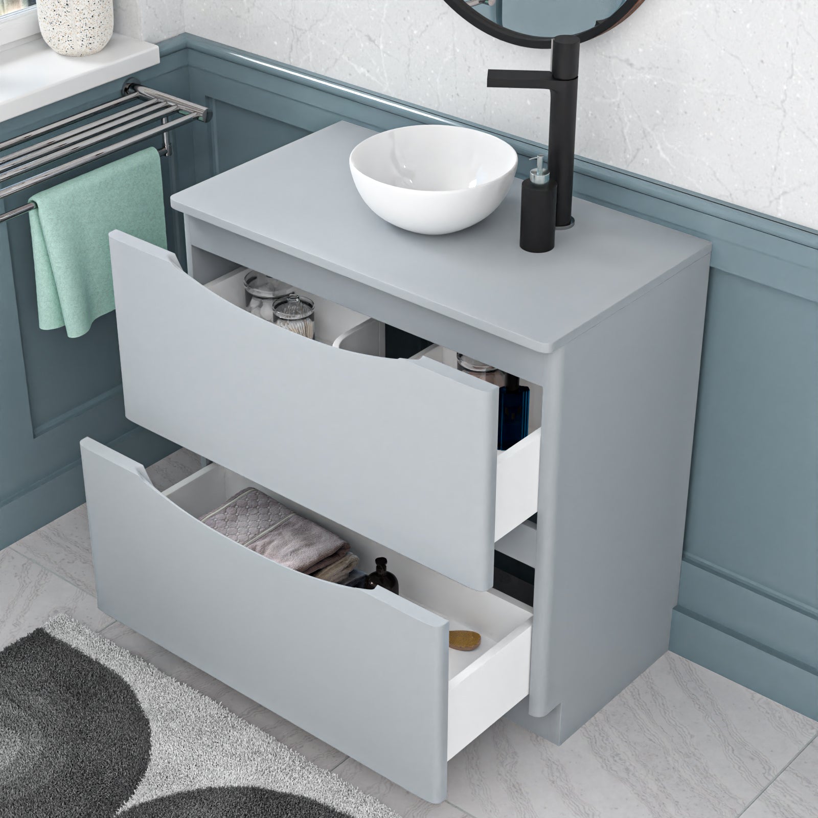 Gray vanity with open drawers in a bathroom setting