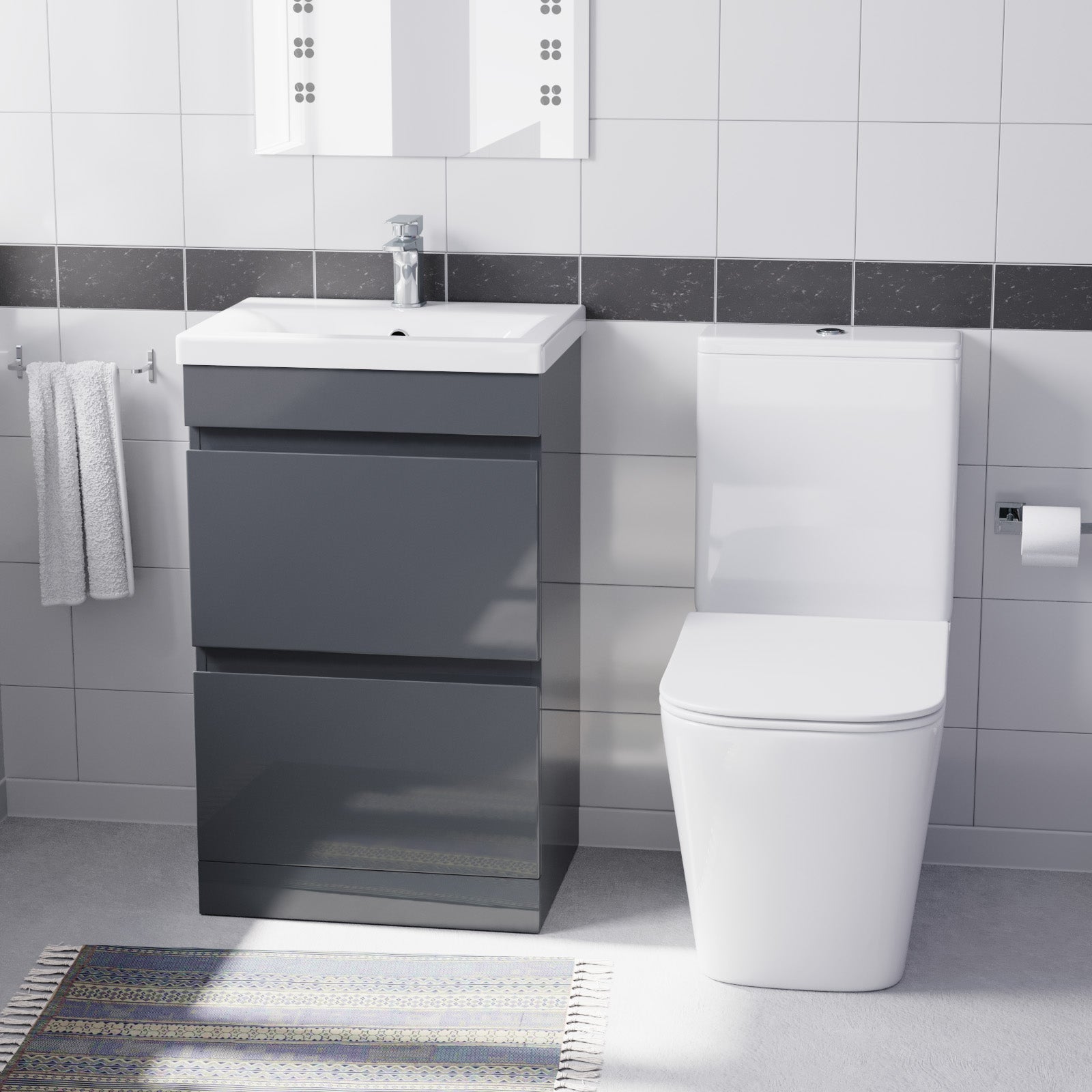 Bathroom setup with a gray vanity unit and white toilet