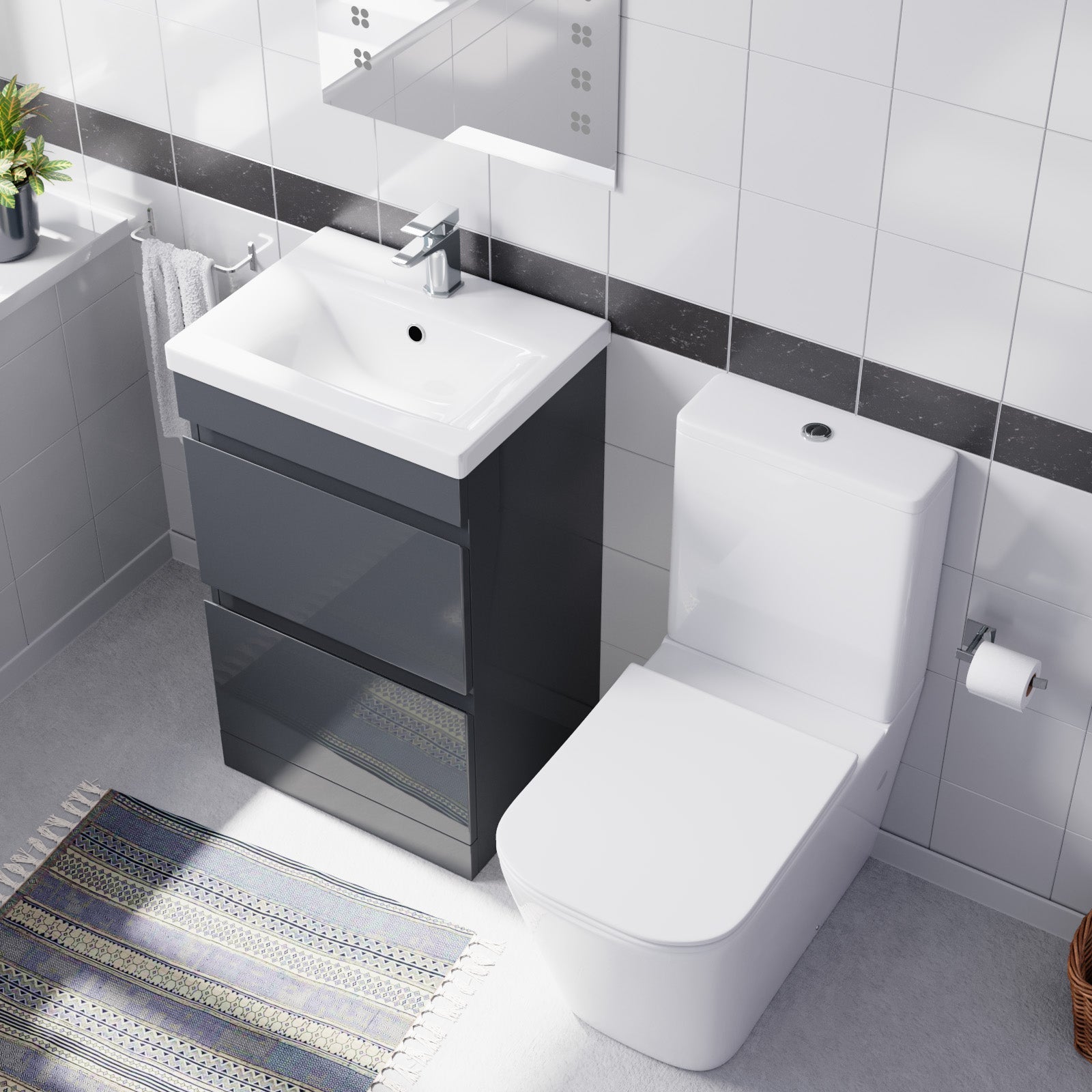 Bathroom setup with a black vanity unit and white toilet.