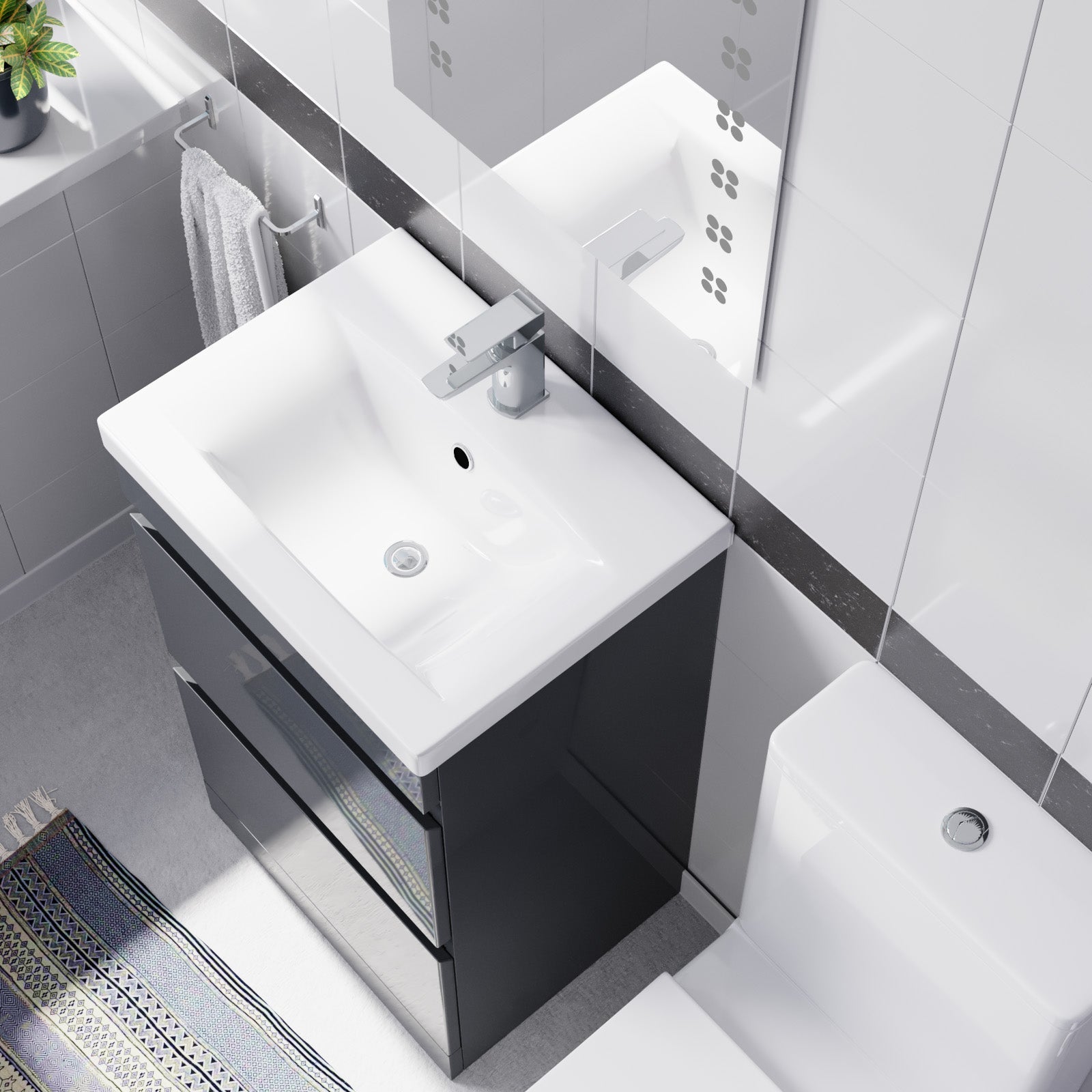 Bathroom vanity with white sink and black cabinet in a modern bathroom setting.