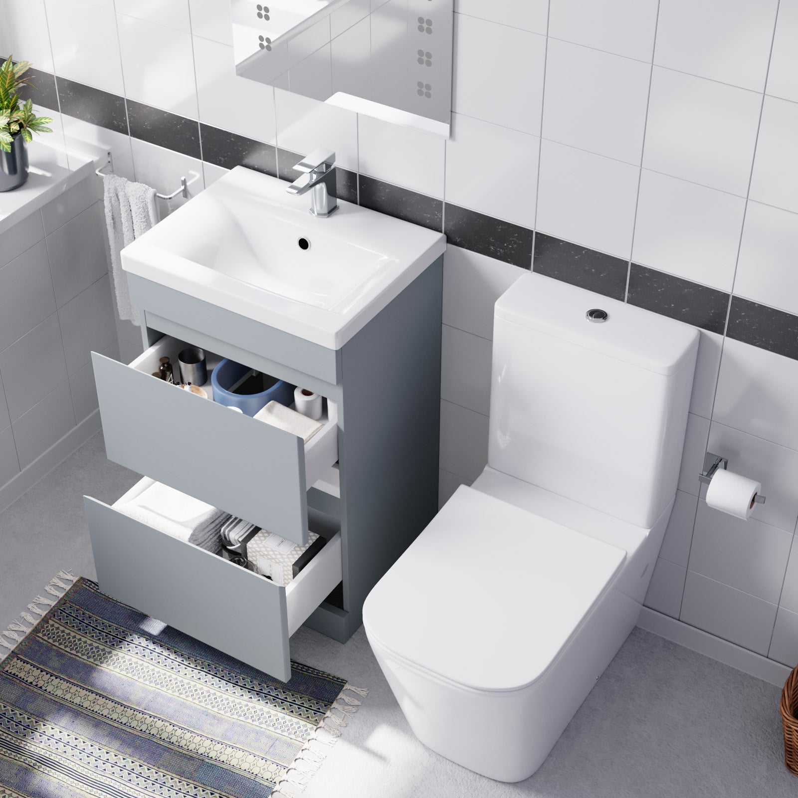 Bathroom setup with a sink vanity and storage space and toilet