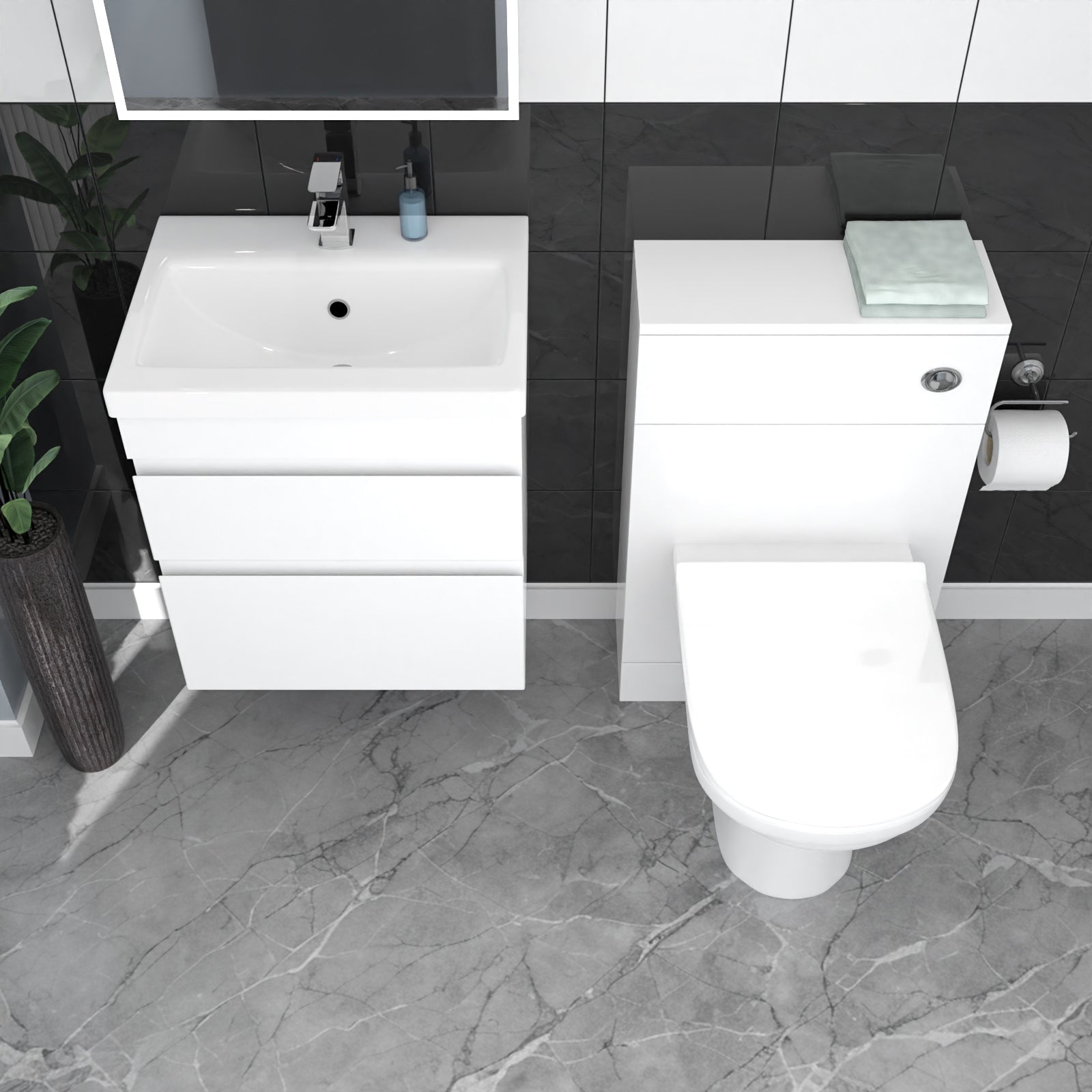 Bathroom setup with white vanity and toilet on a gray tiled floor.