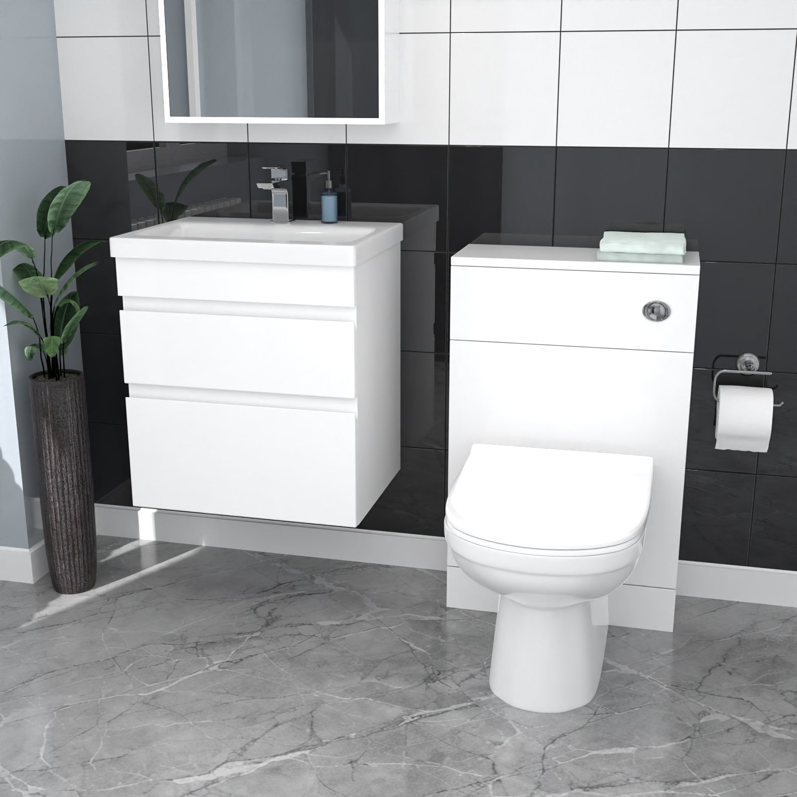 Bathroom setup with white vanity unit and toilet against black tiled walls.