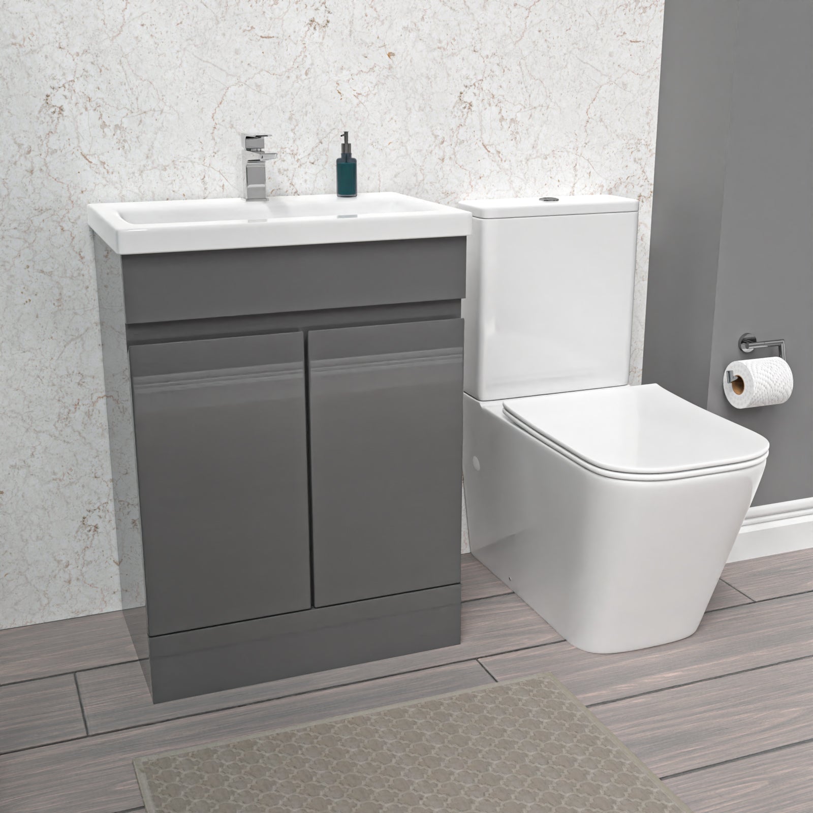 Bathroom setup with gray vanity unit, white toilet, and sink.