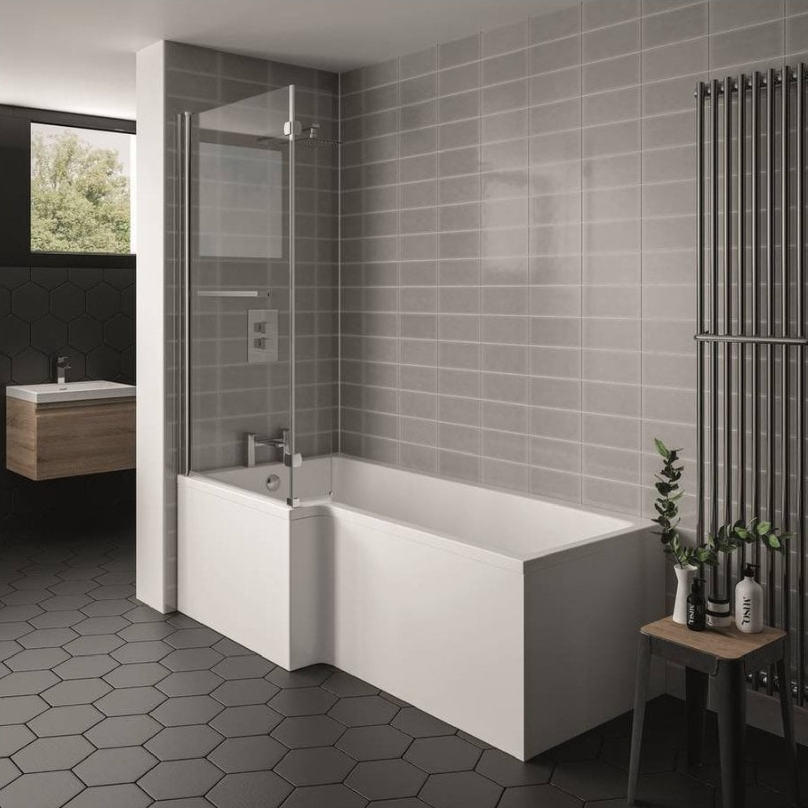 Modern bathroom with a white bathtub, shower screen, and hexagonal floor tiles.