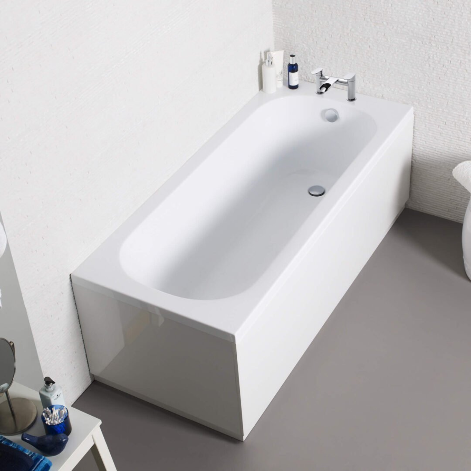 Modern white freestanding bathtub in a bathroom setting