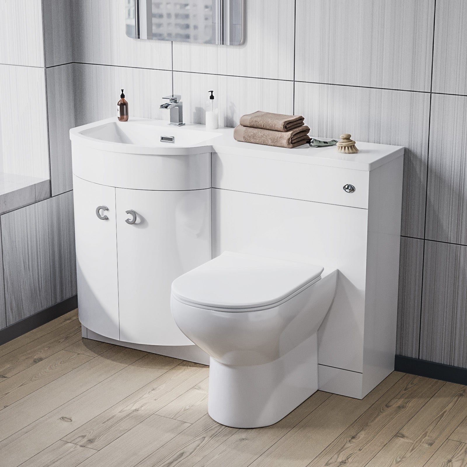 Bathroom setup with a white vanity unit, sink, and toilet