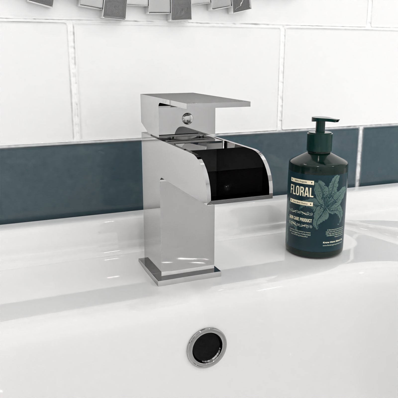 Bathroom sink with chrome faucet and bottle of soap on a white countertop.