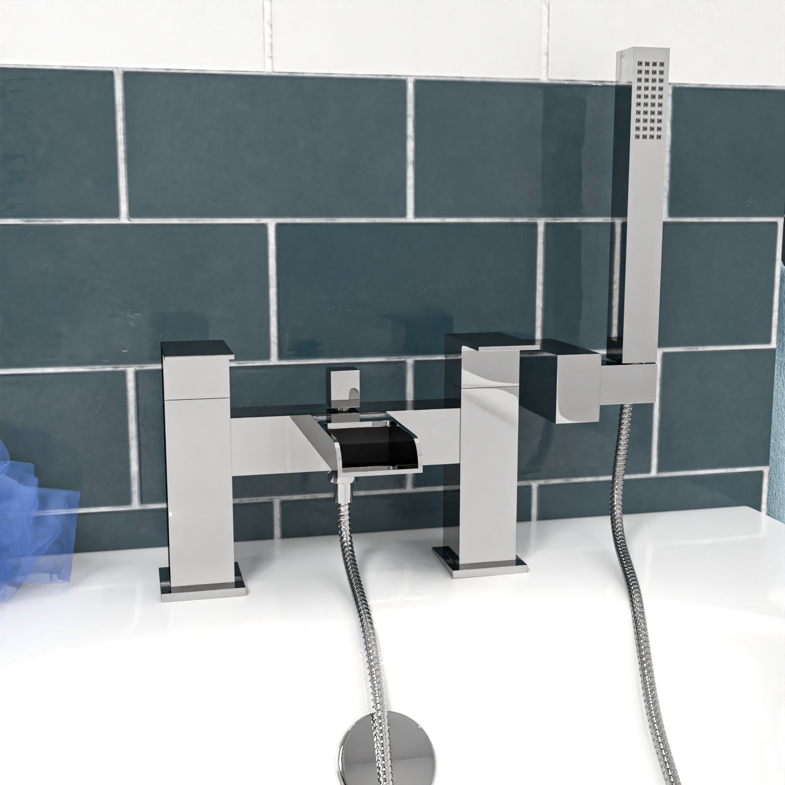 Modern bathroom faucet set with shower head against a tiled wall.
