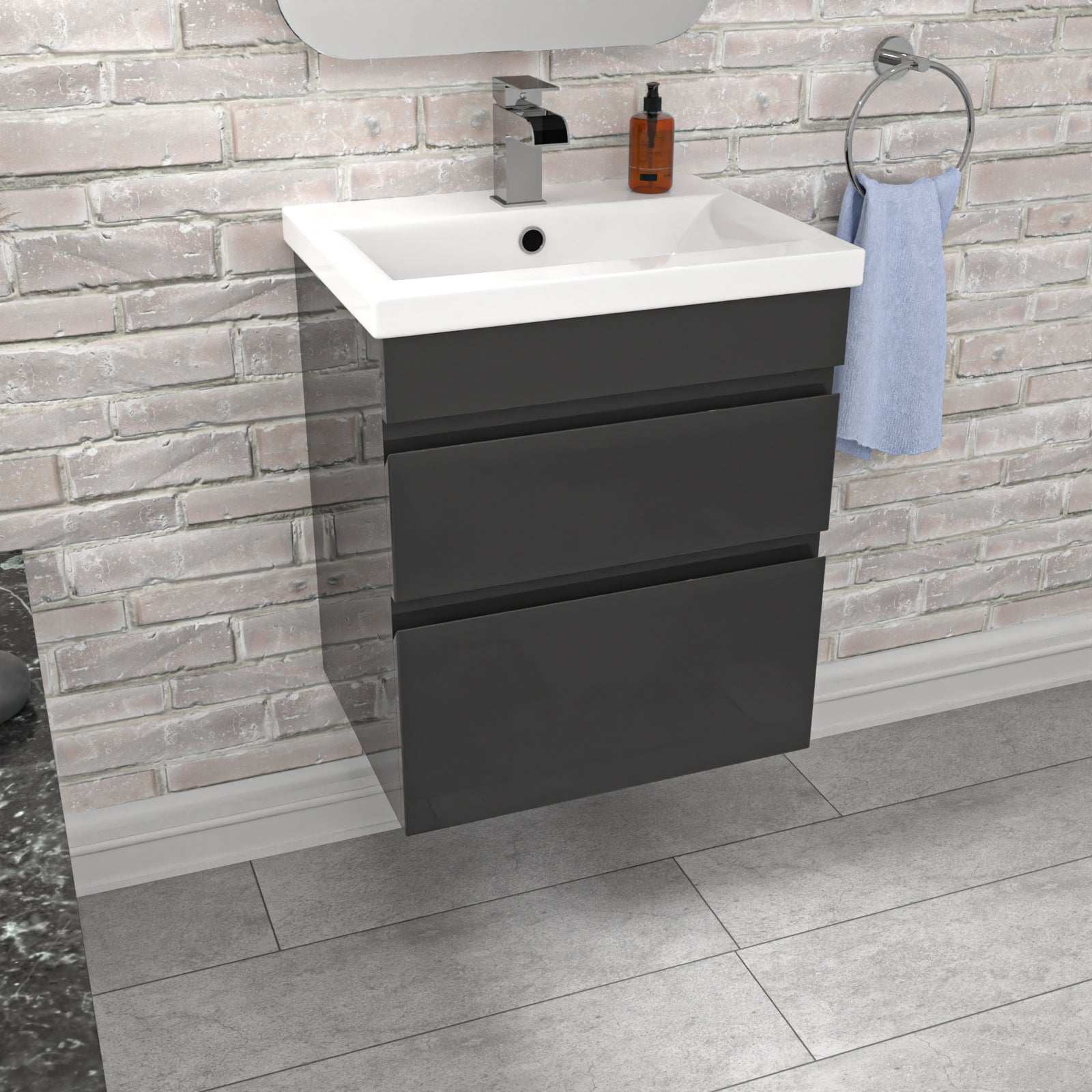 Bathroom vanity with white sink and dark gray cabinet against a brick wall.