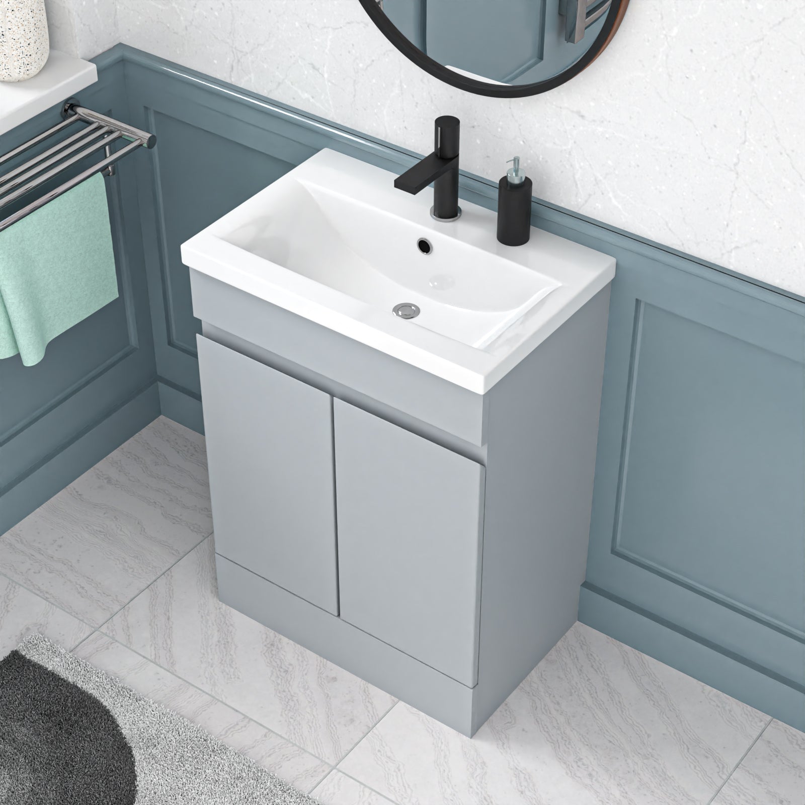 Bathroom vanity with white sink and black faucet against a blue-walled background