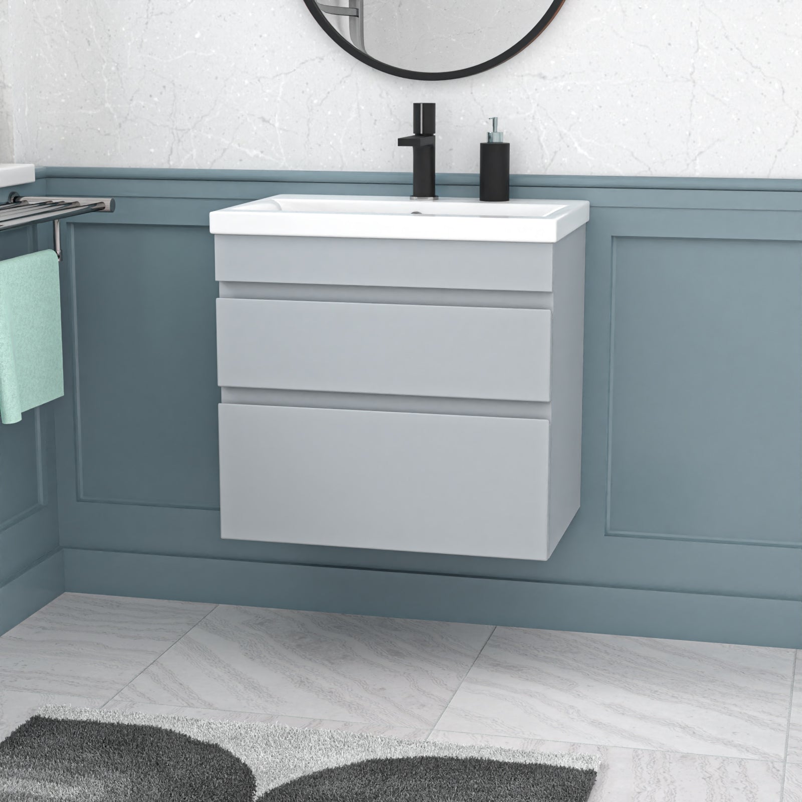 Bathroom vanity with white sink and gray cabinets against a light blue wall.
