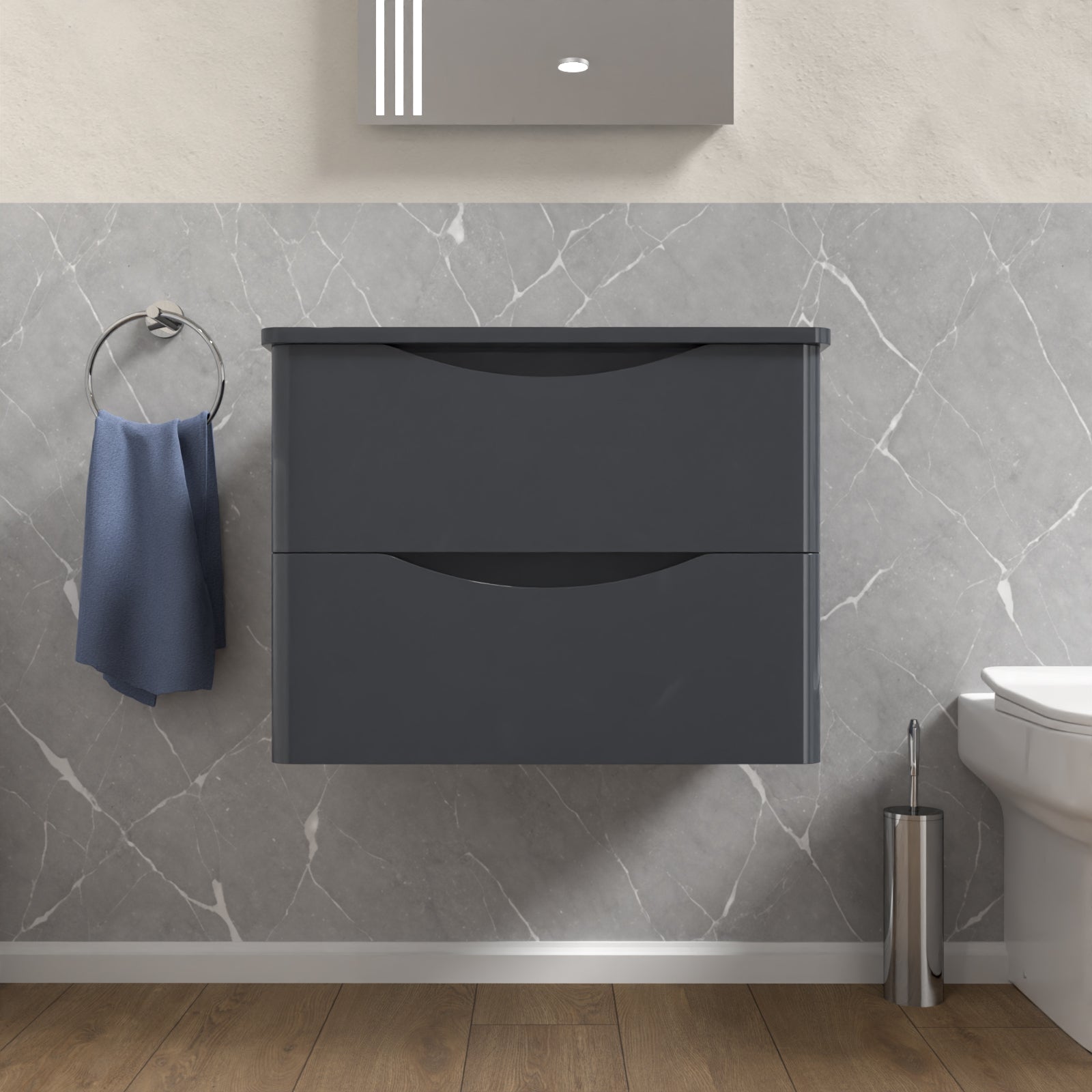 Gray wall-mounted cabinet in a bathroom with marble walls and wooden floor.