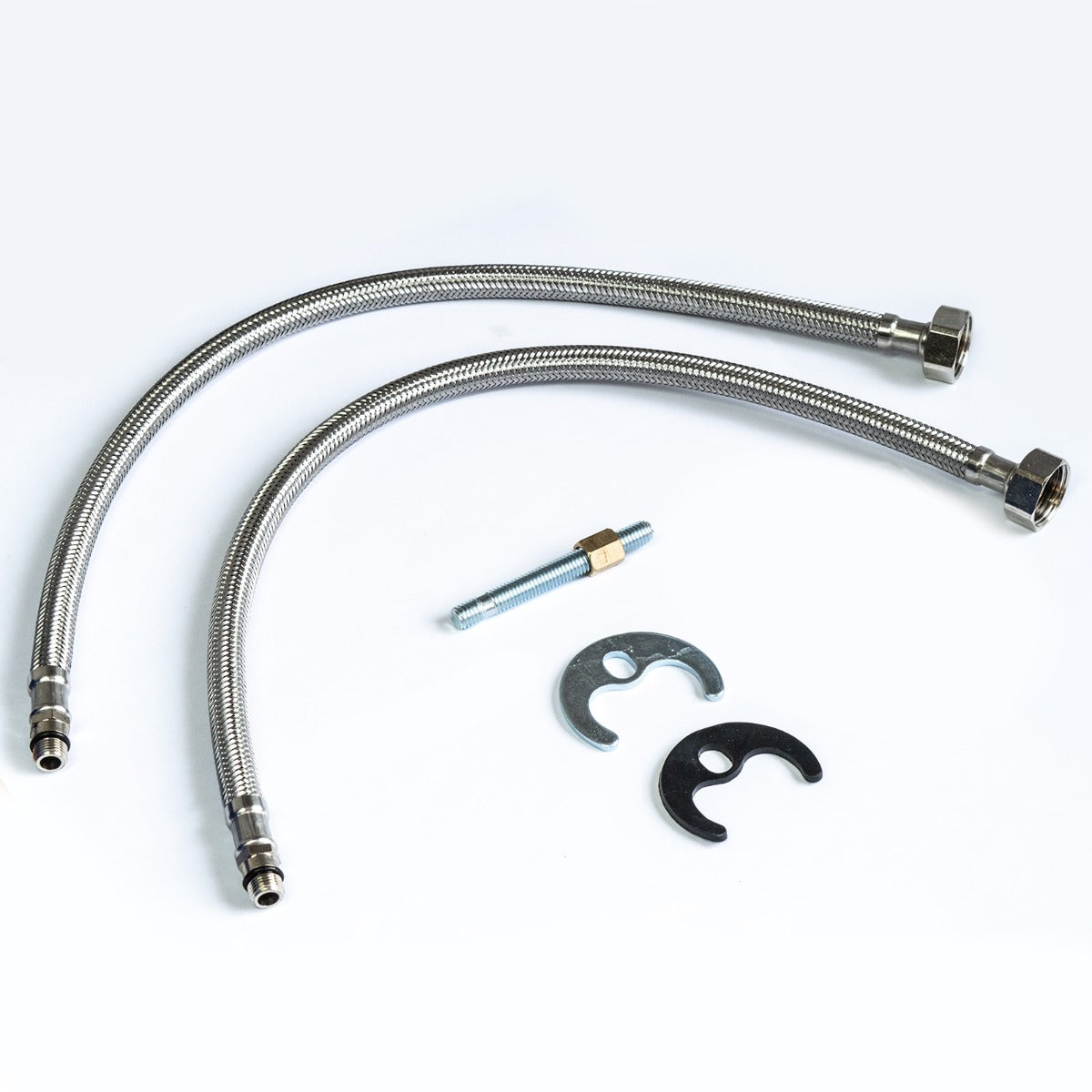 Set of flexible metal hoses, tightening screw and connectors on a white background