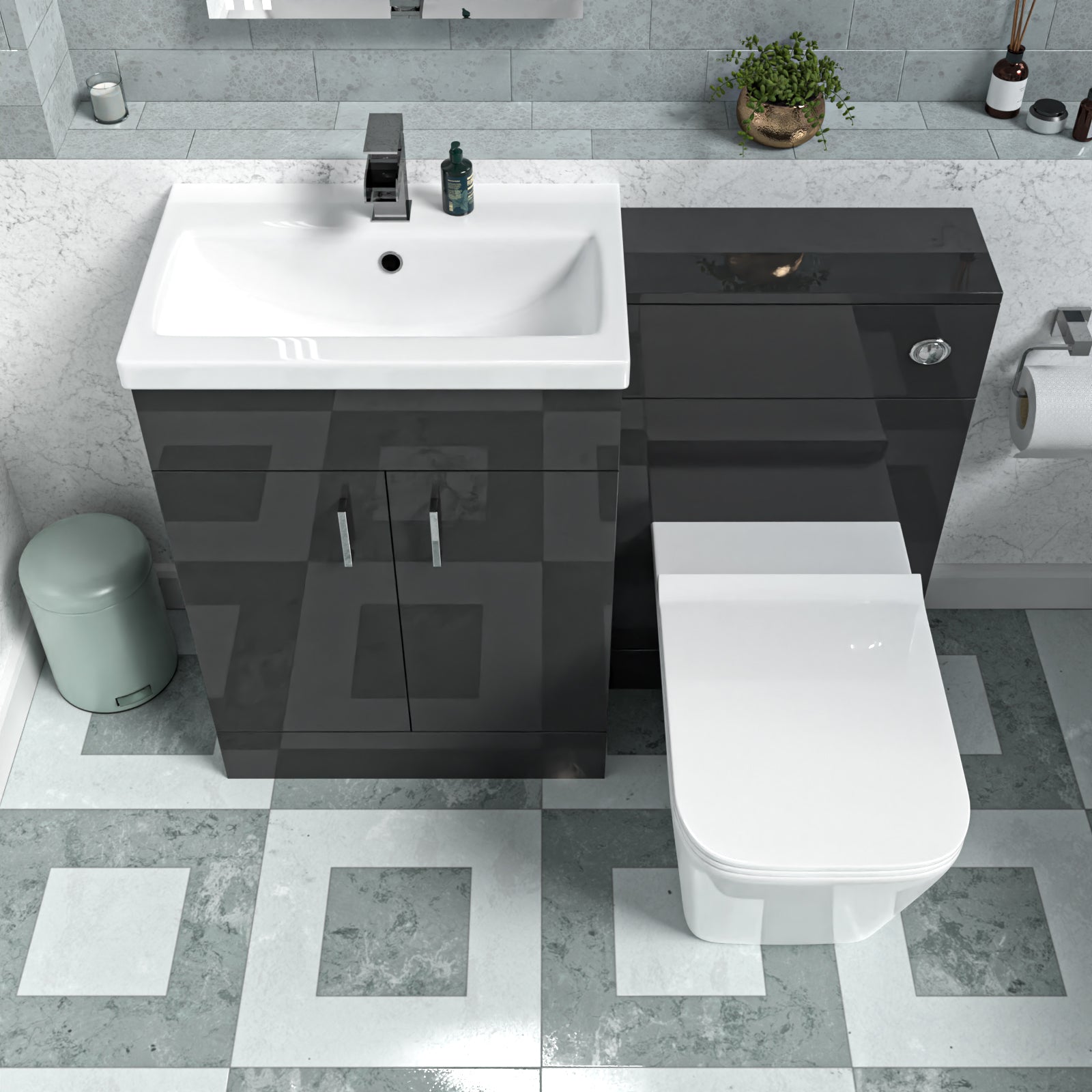 Bathroom setup with black vanity unit, white sink, and toilet on a tiled floor.