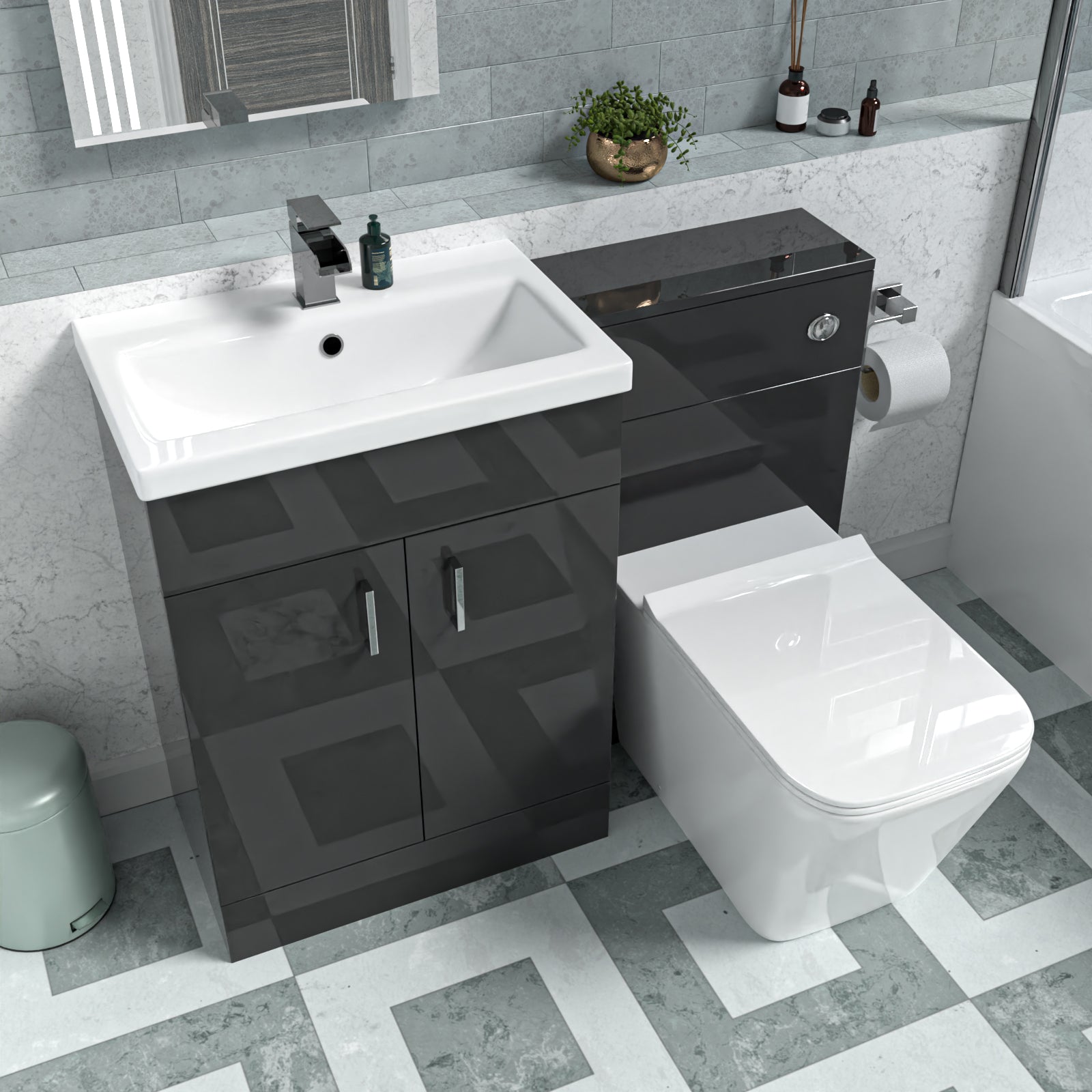 Bathroom setup with dark gray vanity unit, white sink, and toilet.