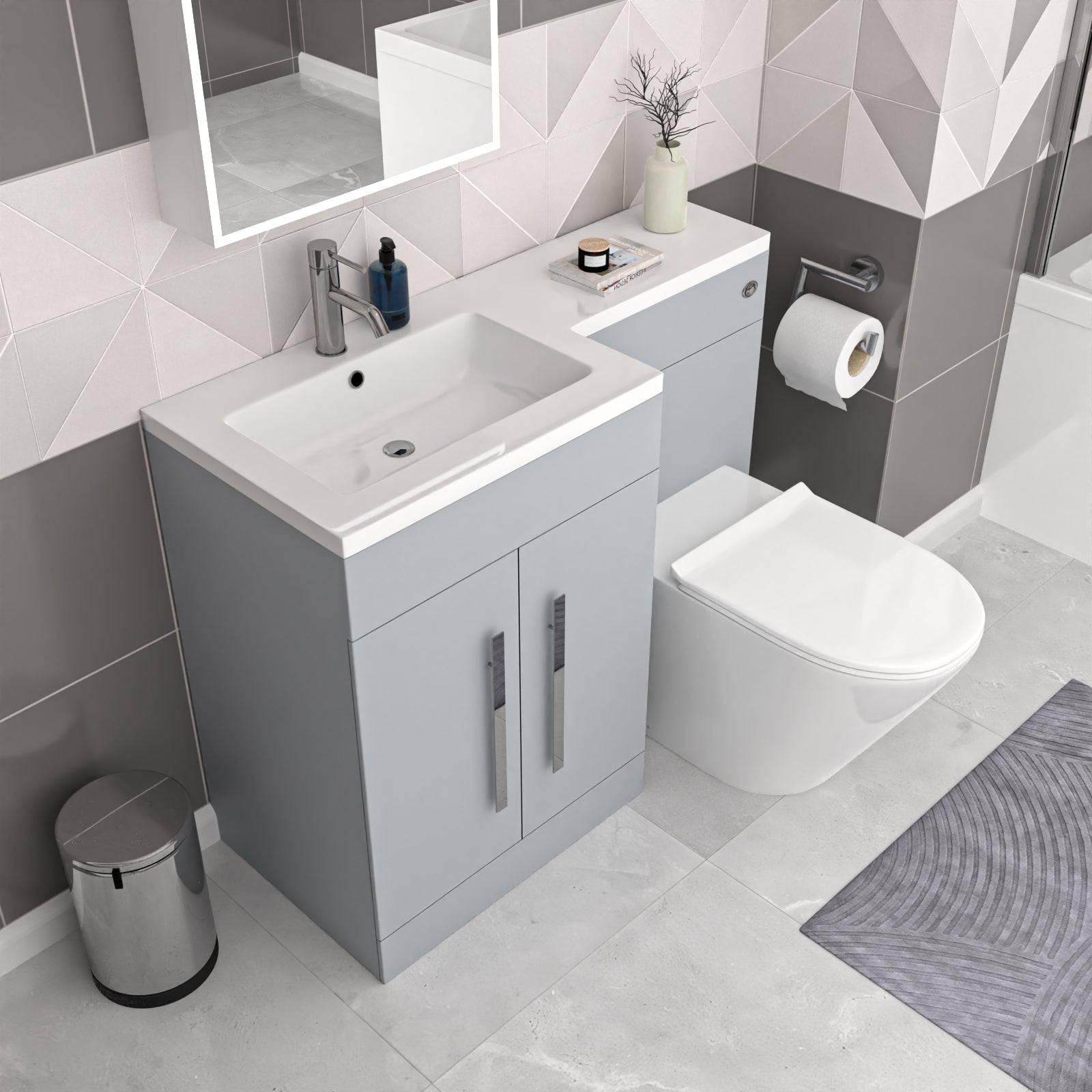 Modern bathroom with gray vanity, white sink, and toilet.