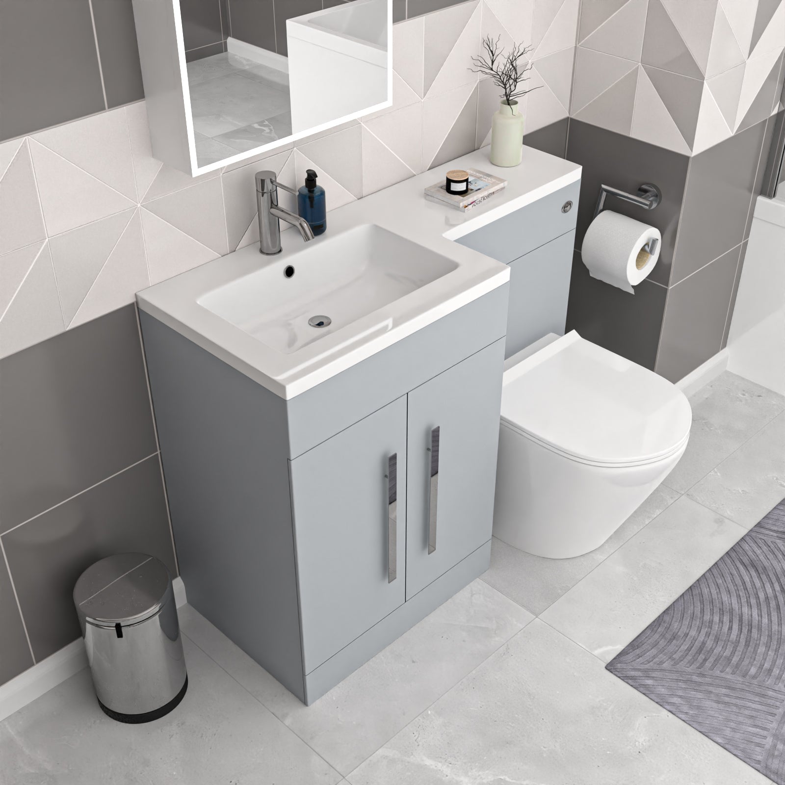 Modern bathroom with gray vanity, white sink, and toilet.