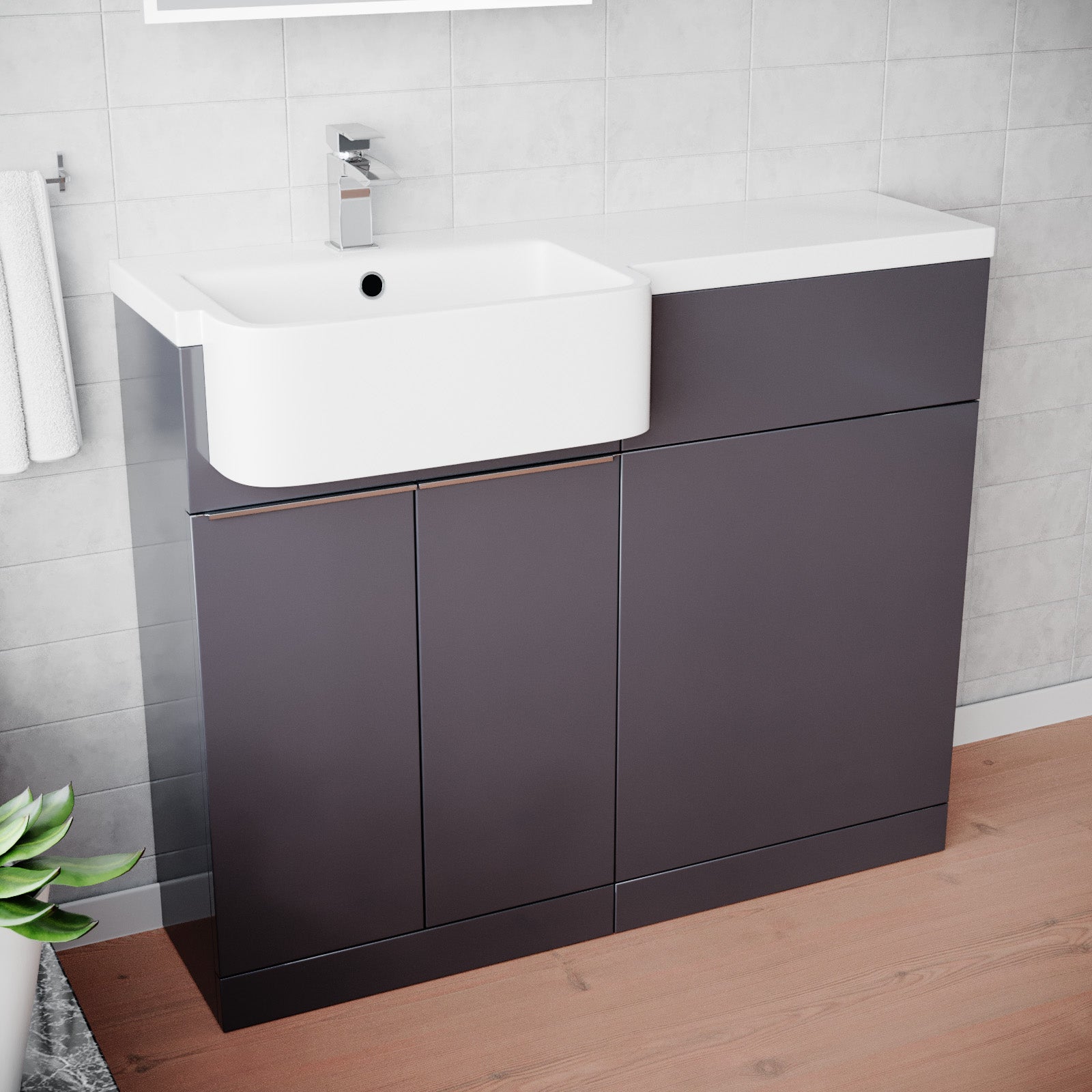 Bathroom vanity with white sink against a tiled wall.