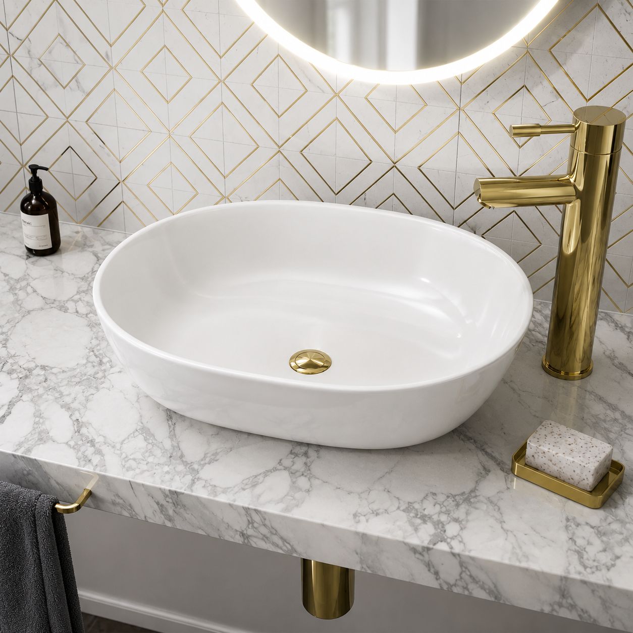 White oval counter-top basin on marble vanity unit with brass mixer tap — Bathroom Republic UK
