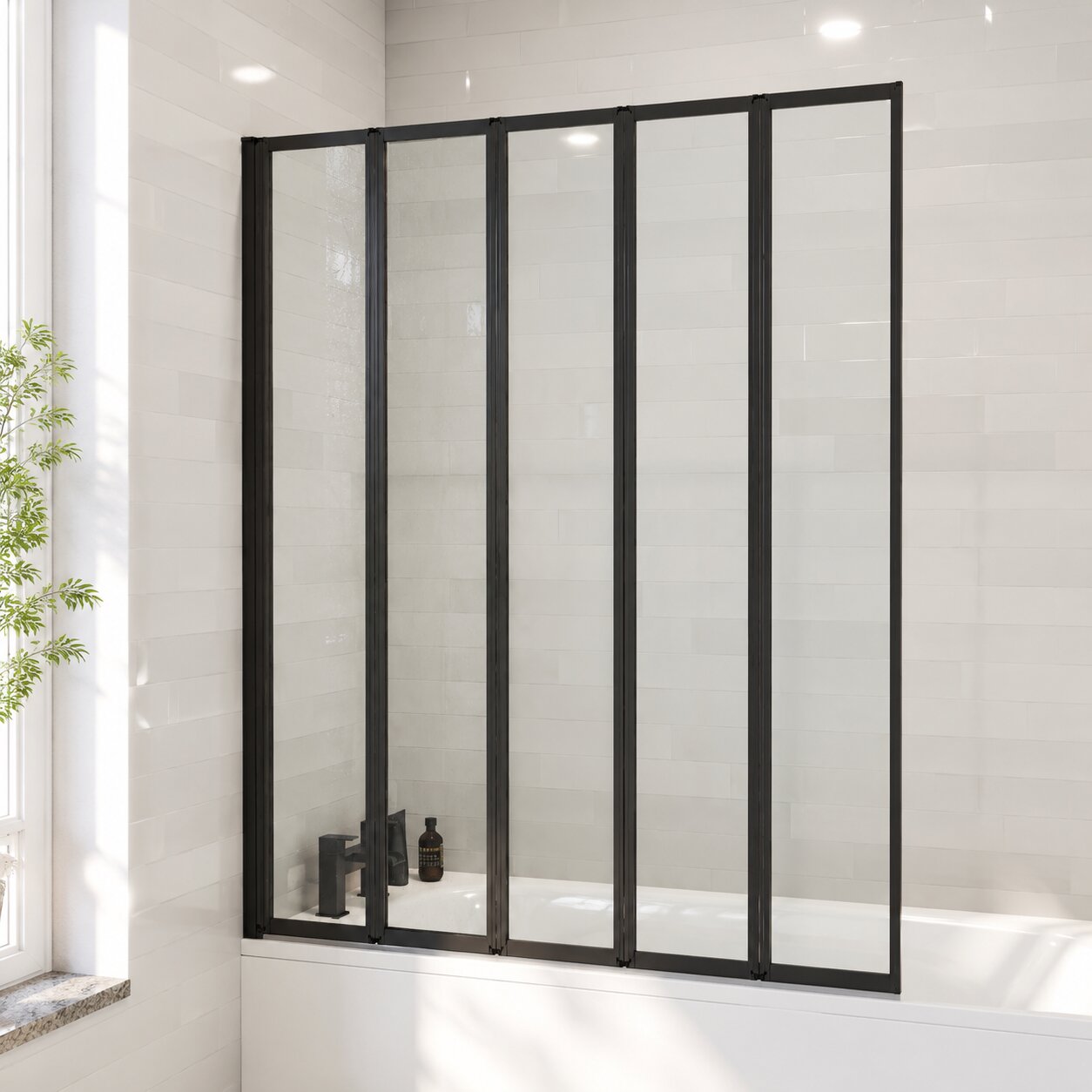 Matt black 5-panel folding bath screen on a white alcove bath — Bathroom Republic UK