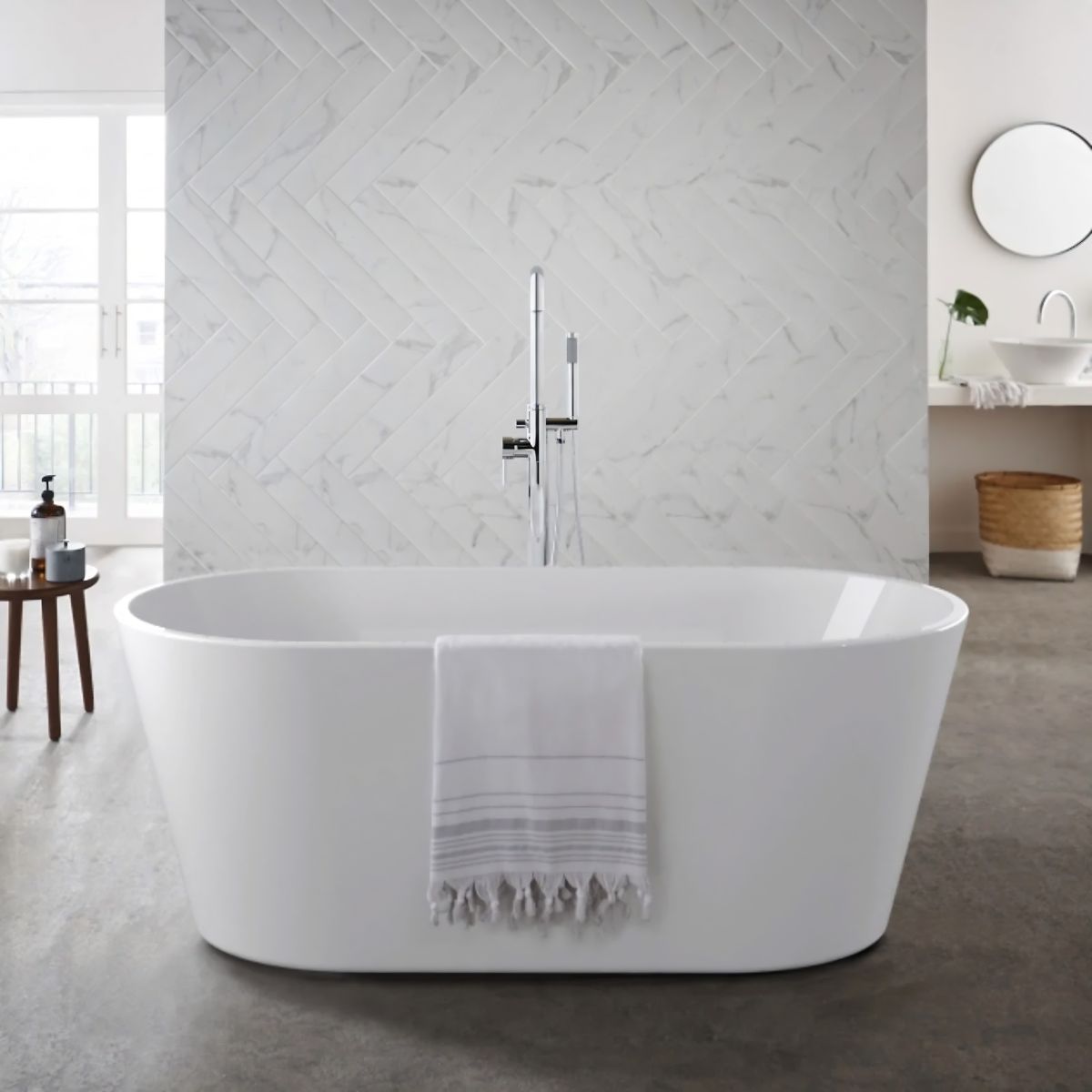 White oval acrylic freestanding bath in a light grey bathroom — Bathroom Republic UK
